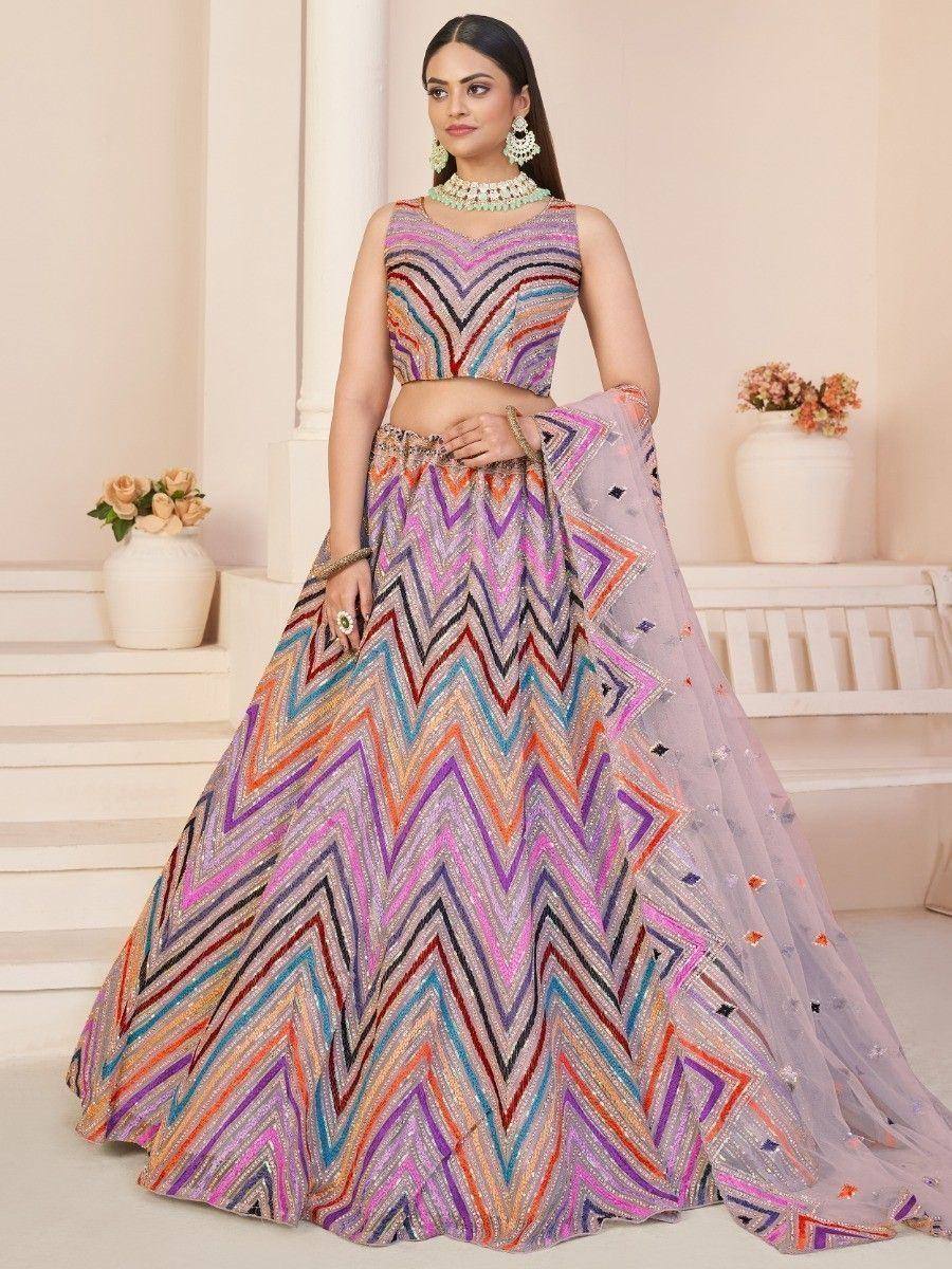 Colorful zigzag embroidered lehenga choli with sheer dupatta, perfect for Indian ethnic occasions