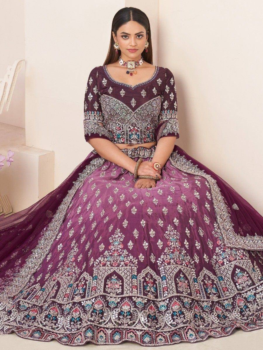 Purple embroidered lehenga choli with intricate silver and floral detailing, perfect for Indian ethnic wear occasions.