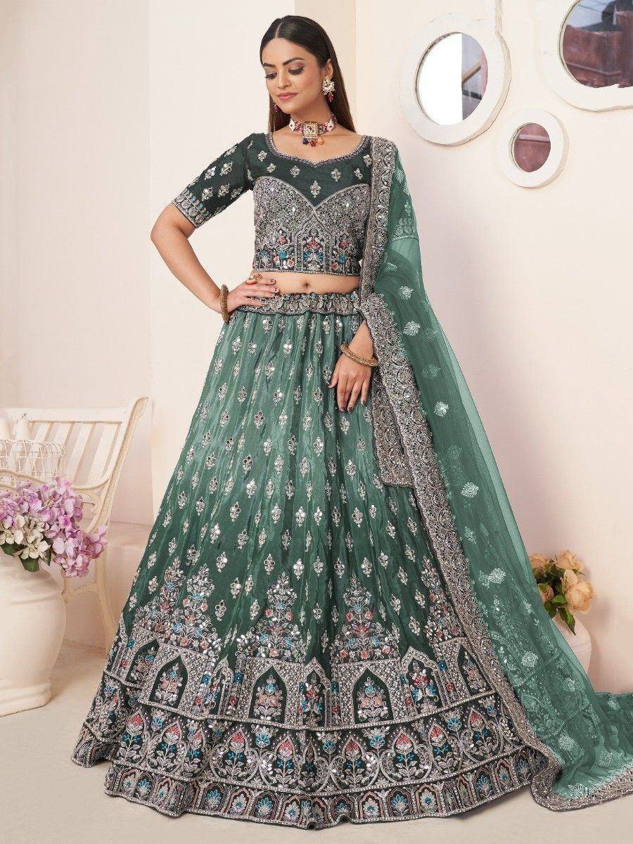 Emerald green embroidered lehenga choli with heavy floral work and matching dupatta for Indian weddings