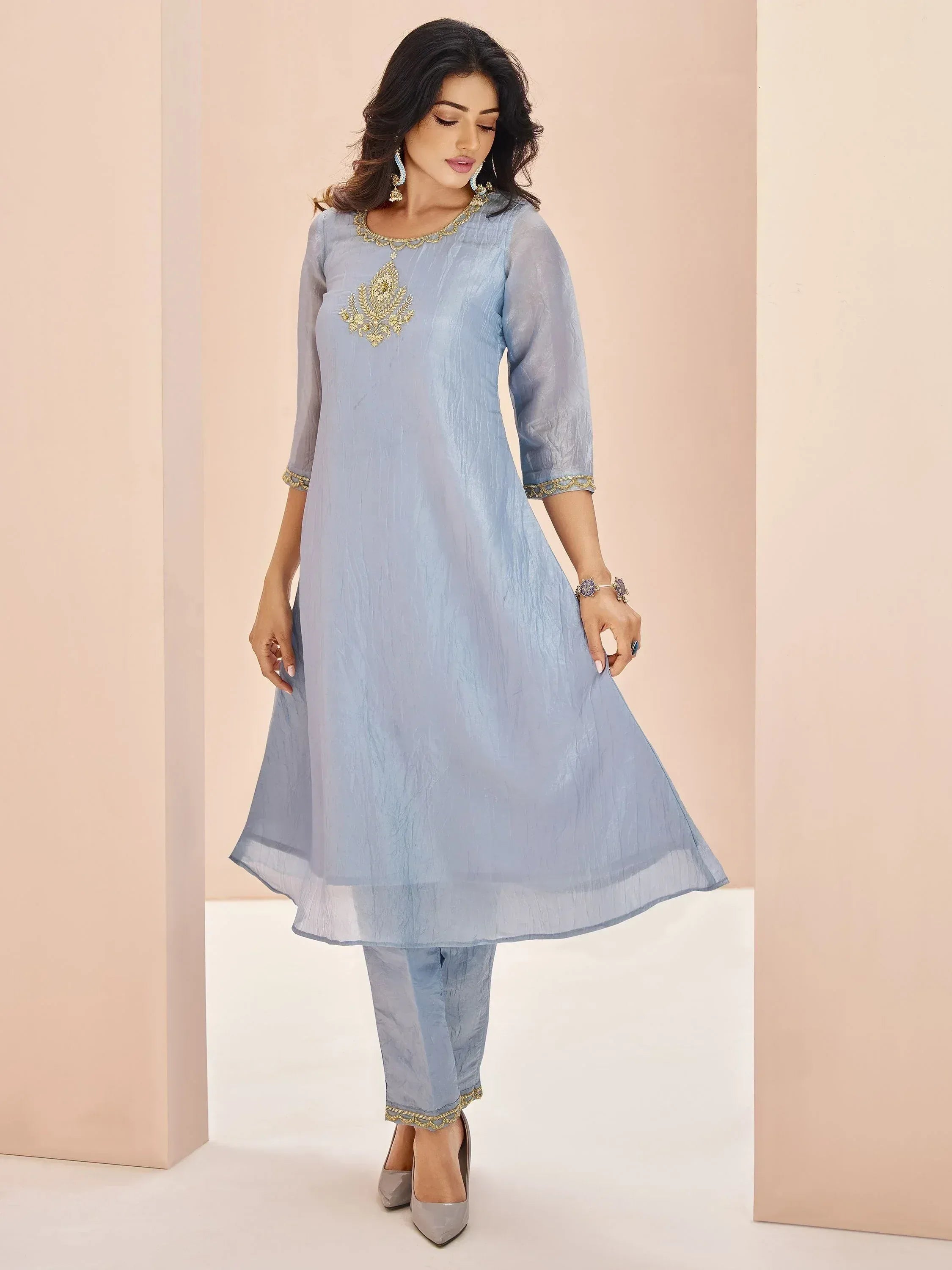 Light blue ethnic kurta with gold embroidery and matching pants, perfect for Indian occasions