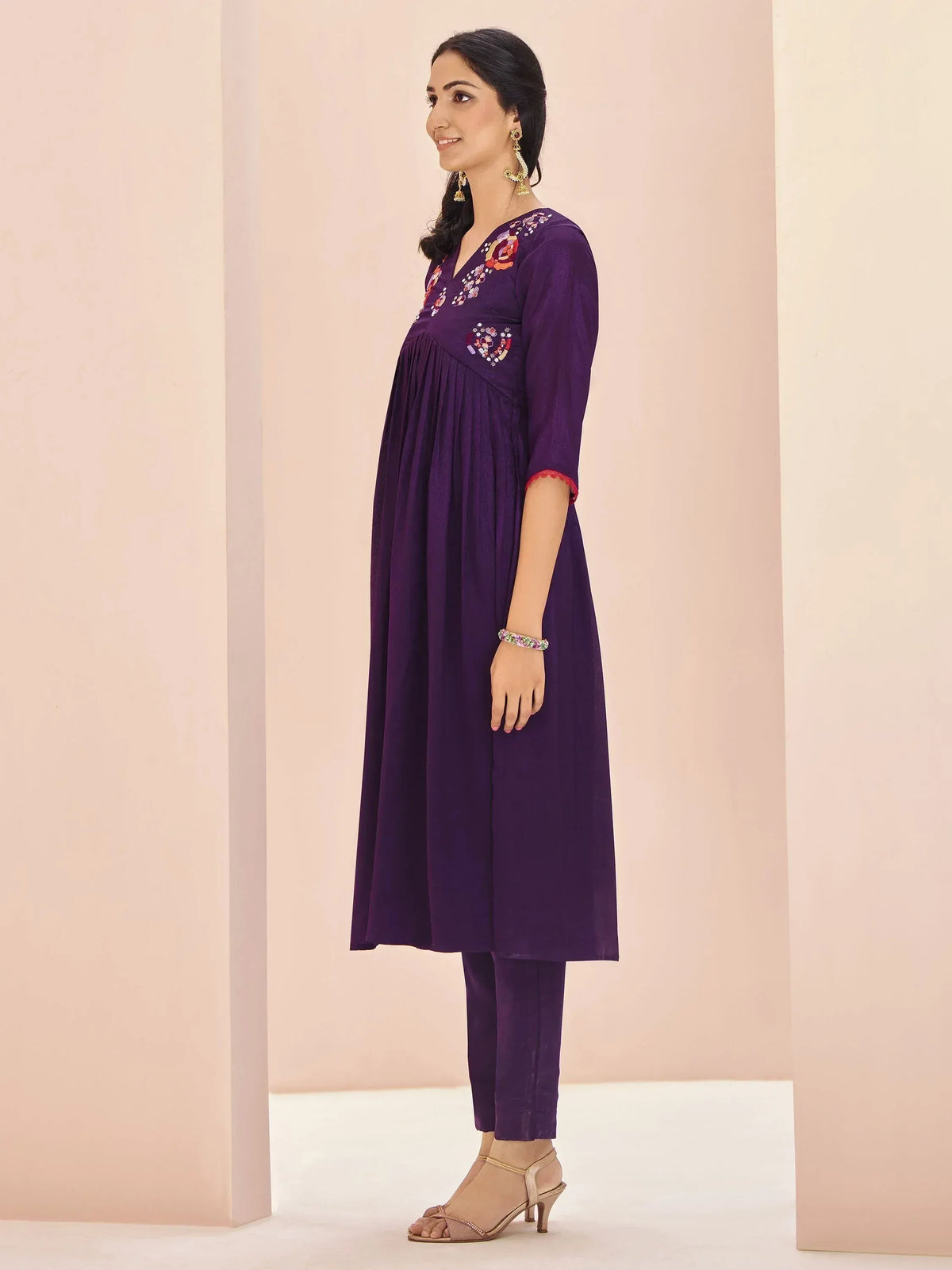 Purple embroidered ethnic kurta with matching pants, floral neckline detail, ideal for Indian occasions