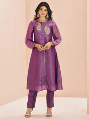 Woman in a purple designer ethnic kurta set with paisley embroidery at Ethnic Plus