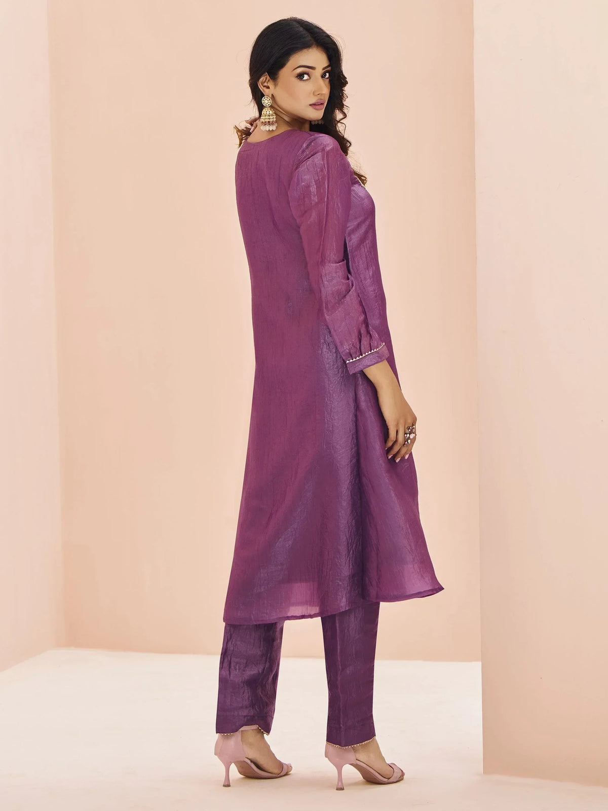 Purple ethnic kurta set with matching pants and elegant embroidery details