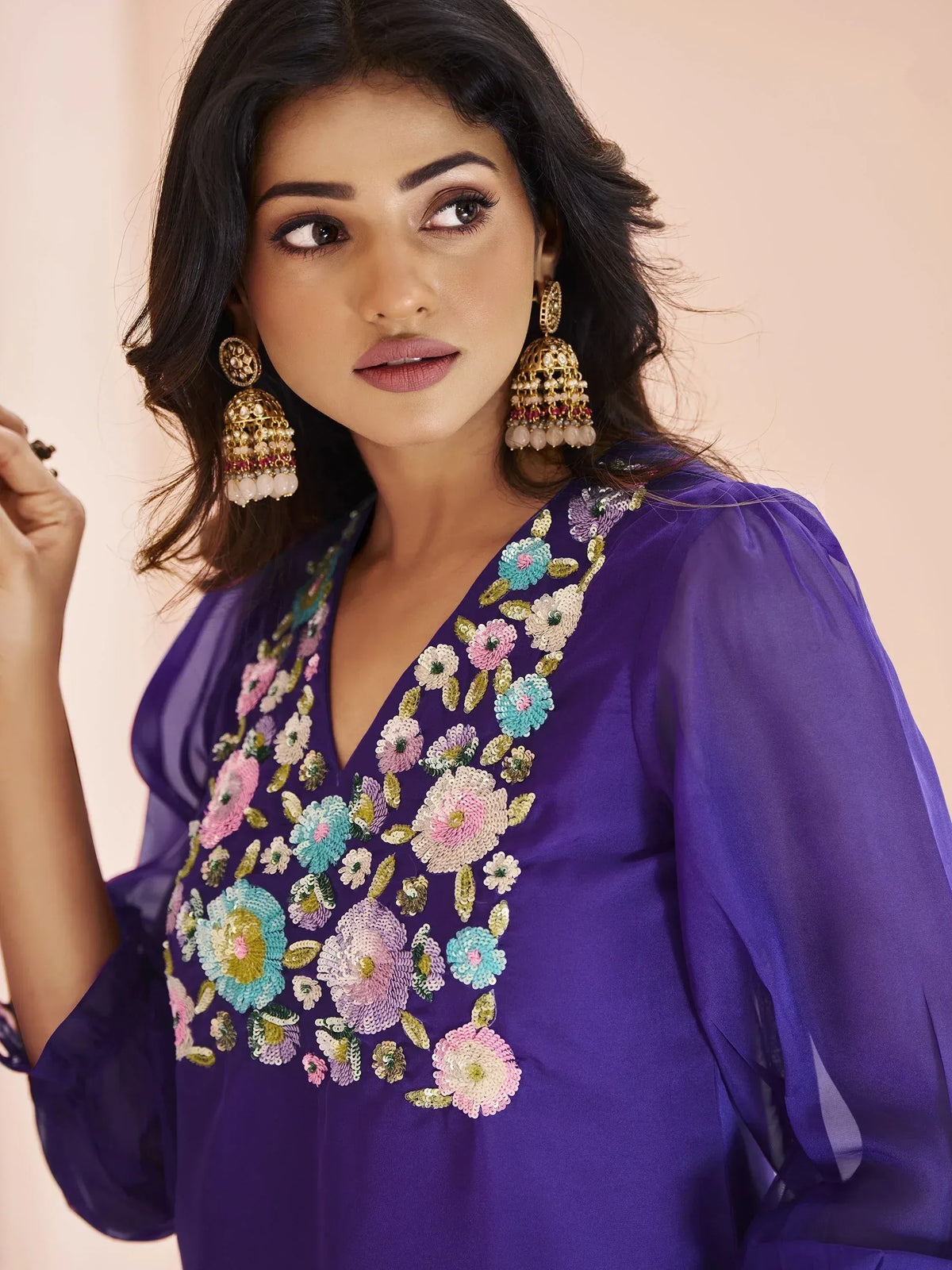 Purple ethnic gown with floral sequin embroidery and jhumka earrings