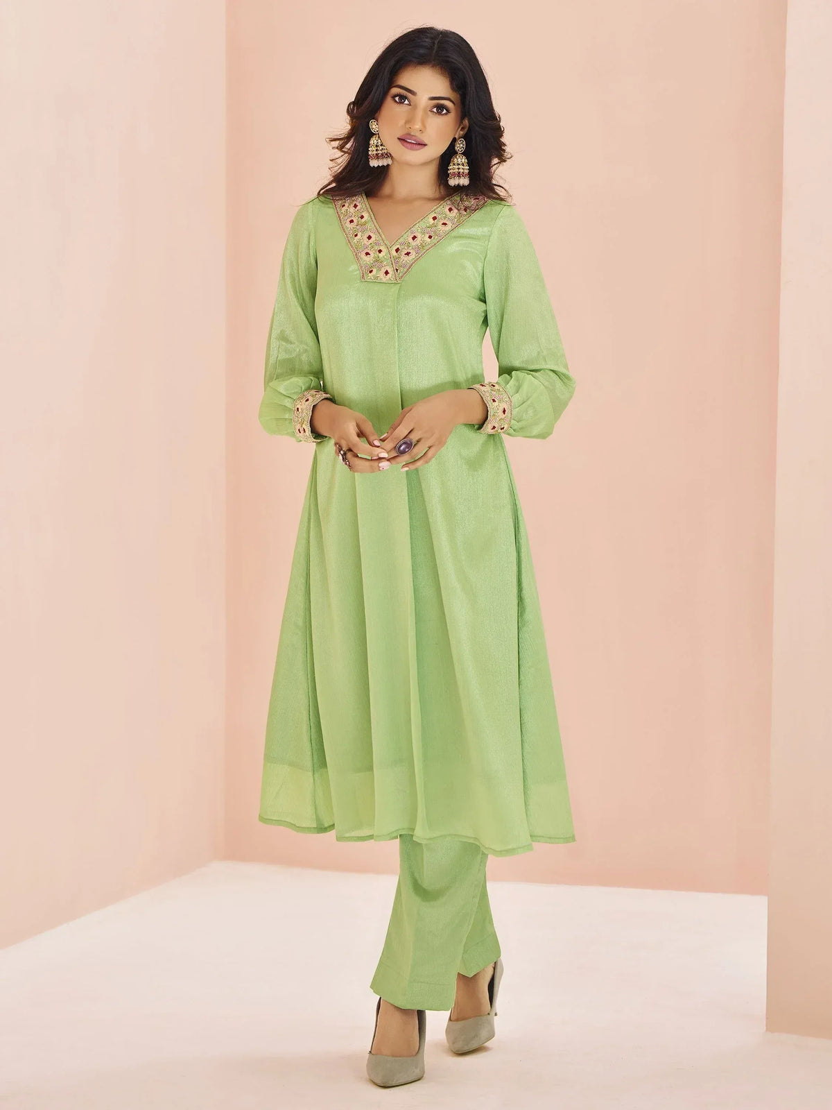 Light green ethnic kurta with embroidered neckline and cuffs, paired with matching palazzo pants