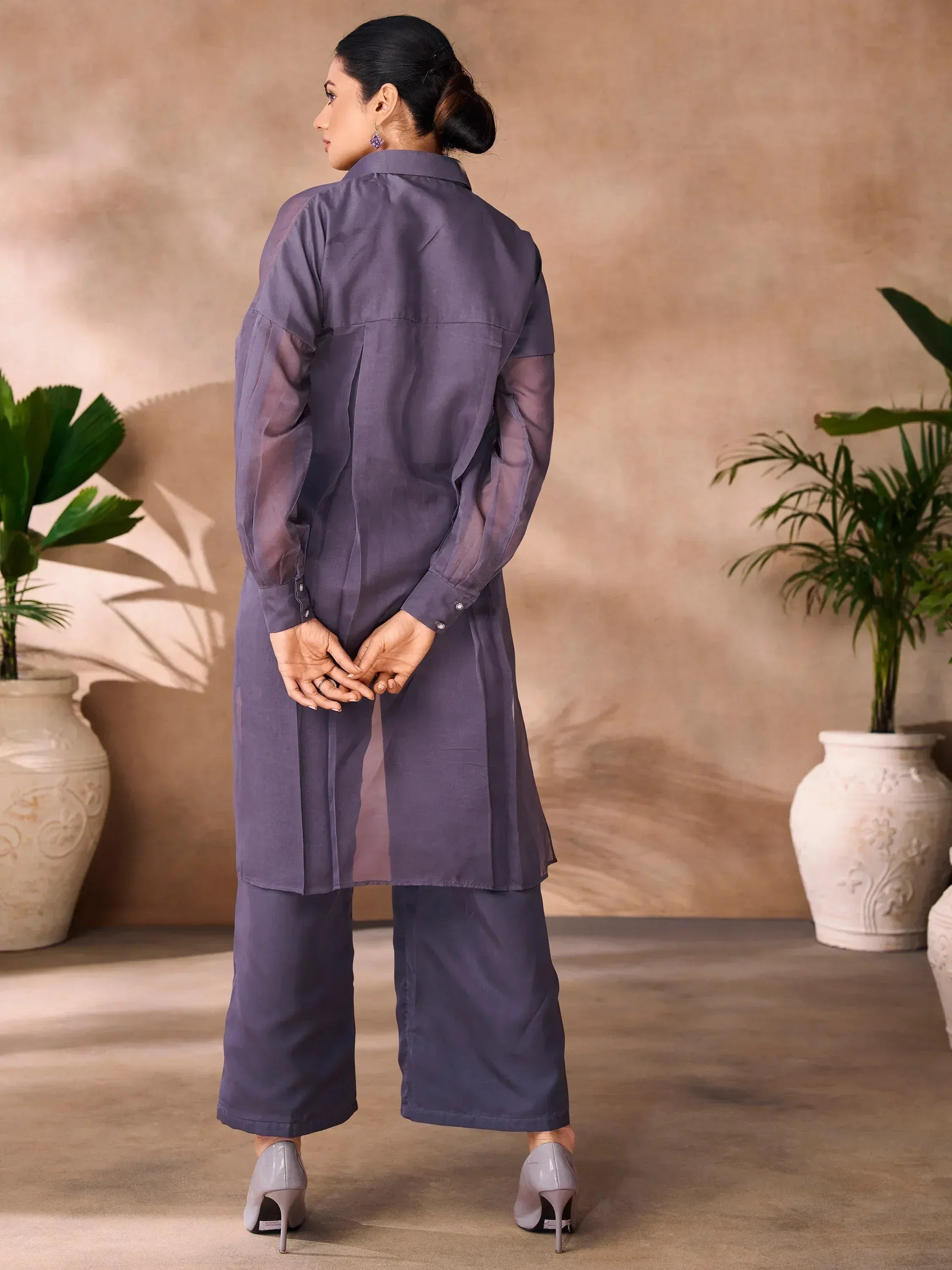 Purple ethnic kurta set with wide pants, perfect for modern Indian wear