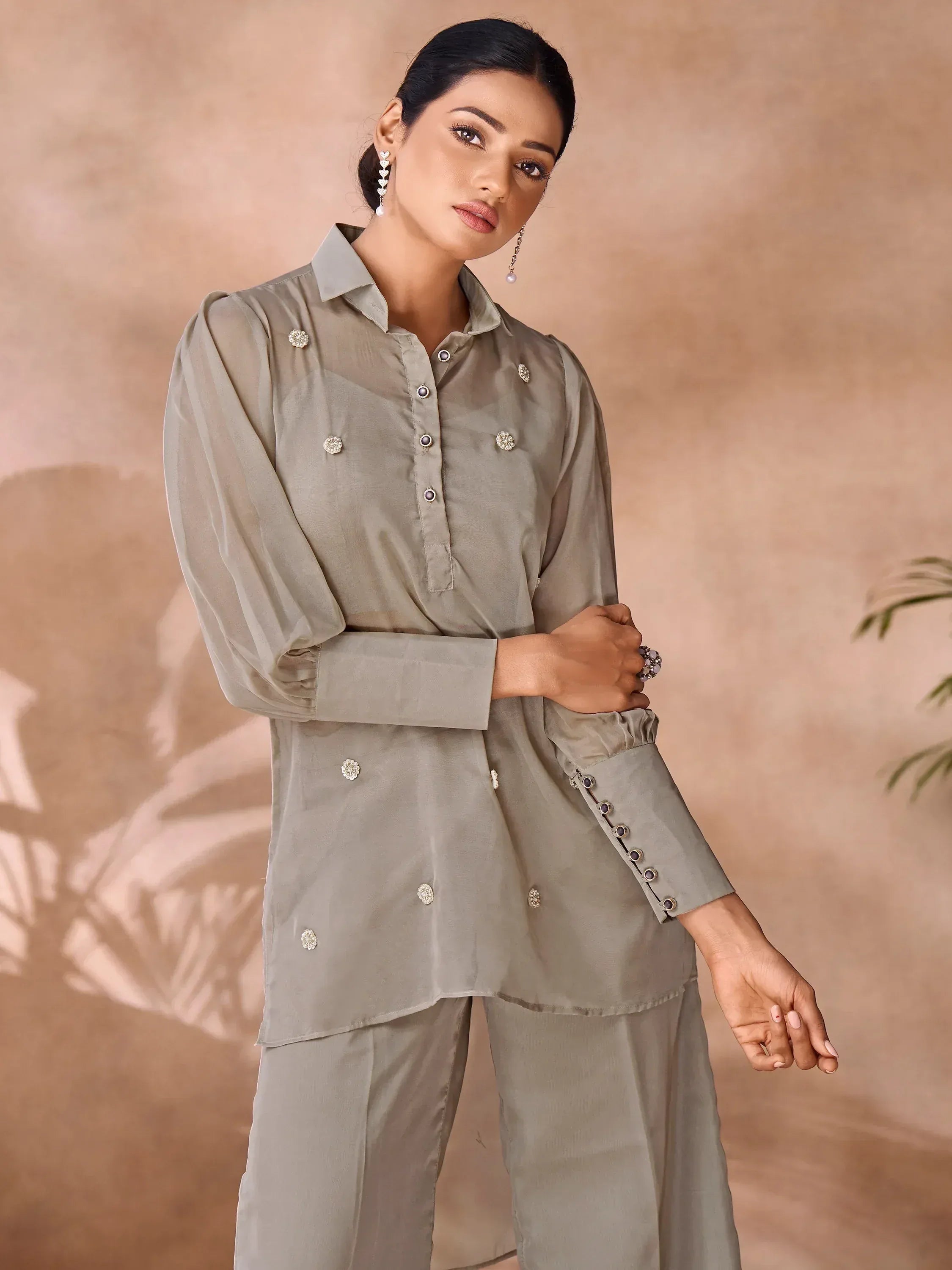 Stylish grey ethnic kurta set with floral embellishments and puff sleeves, perfect for modern Indian wear.