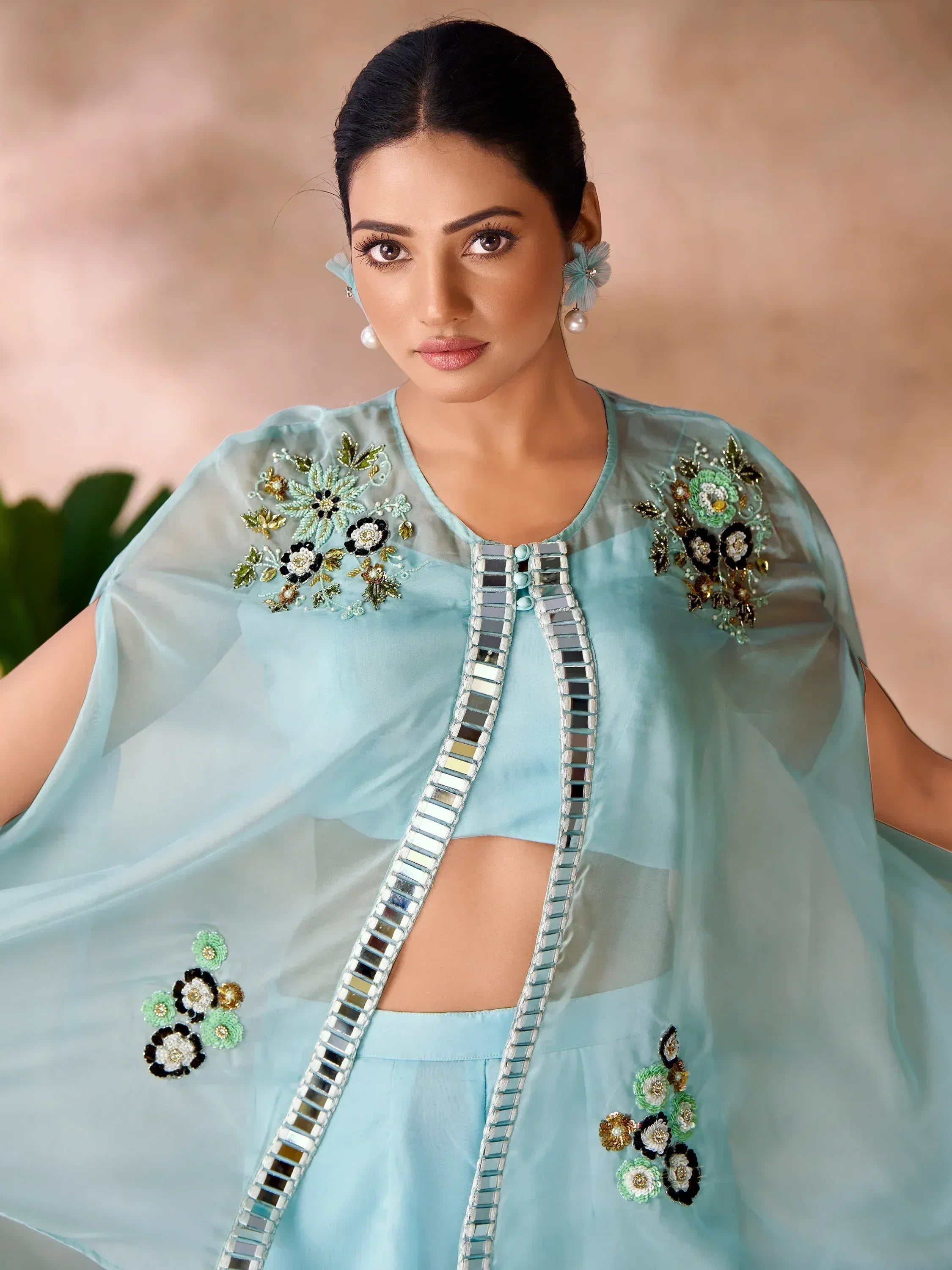 Light blue ethnic gown with floral embroidery and mirror work, perfect for Indian occasions