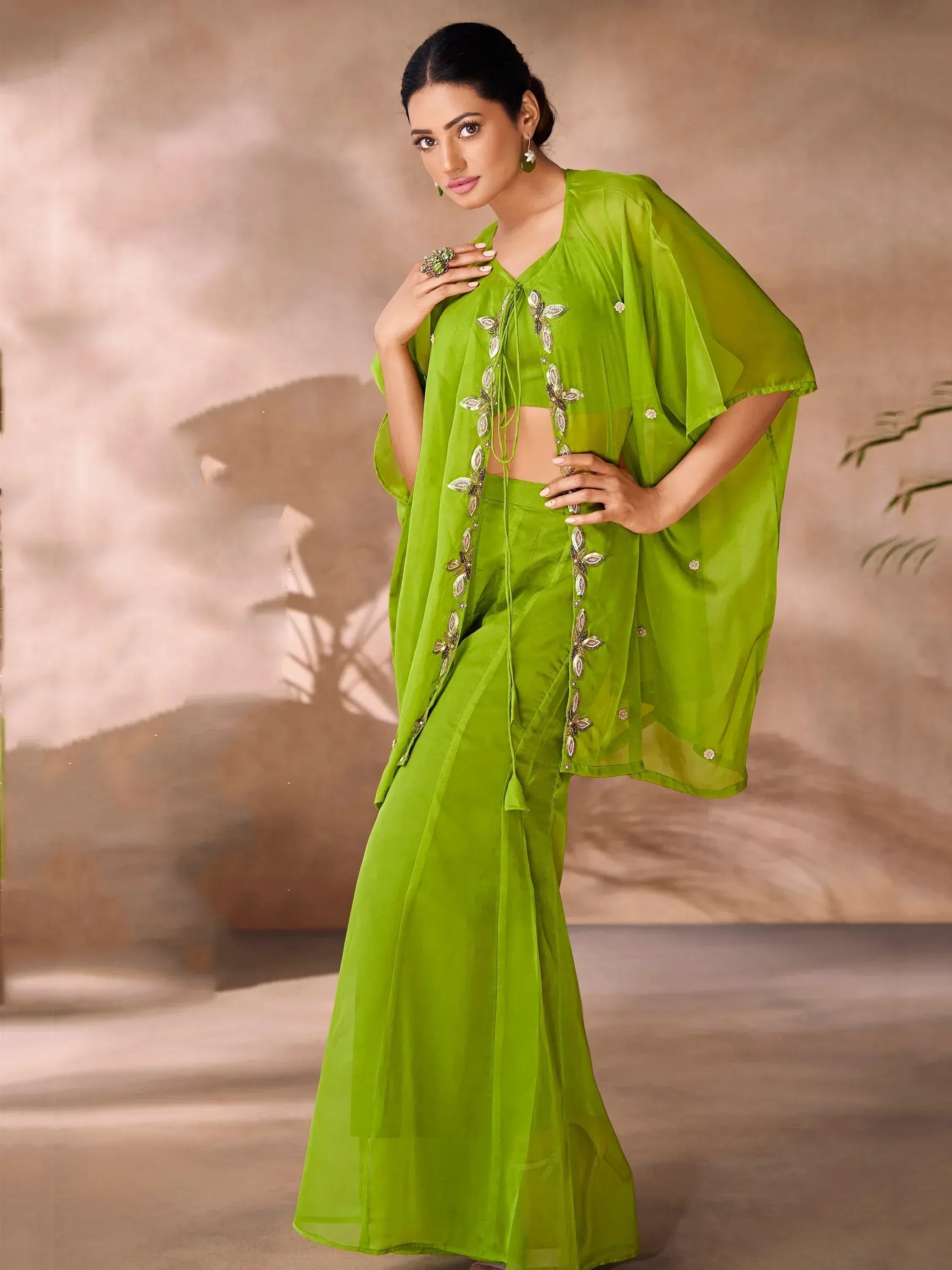 Vibrant green ethnic gown with floral embroidery, perfect for Indian occasions and festive wear.