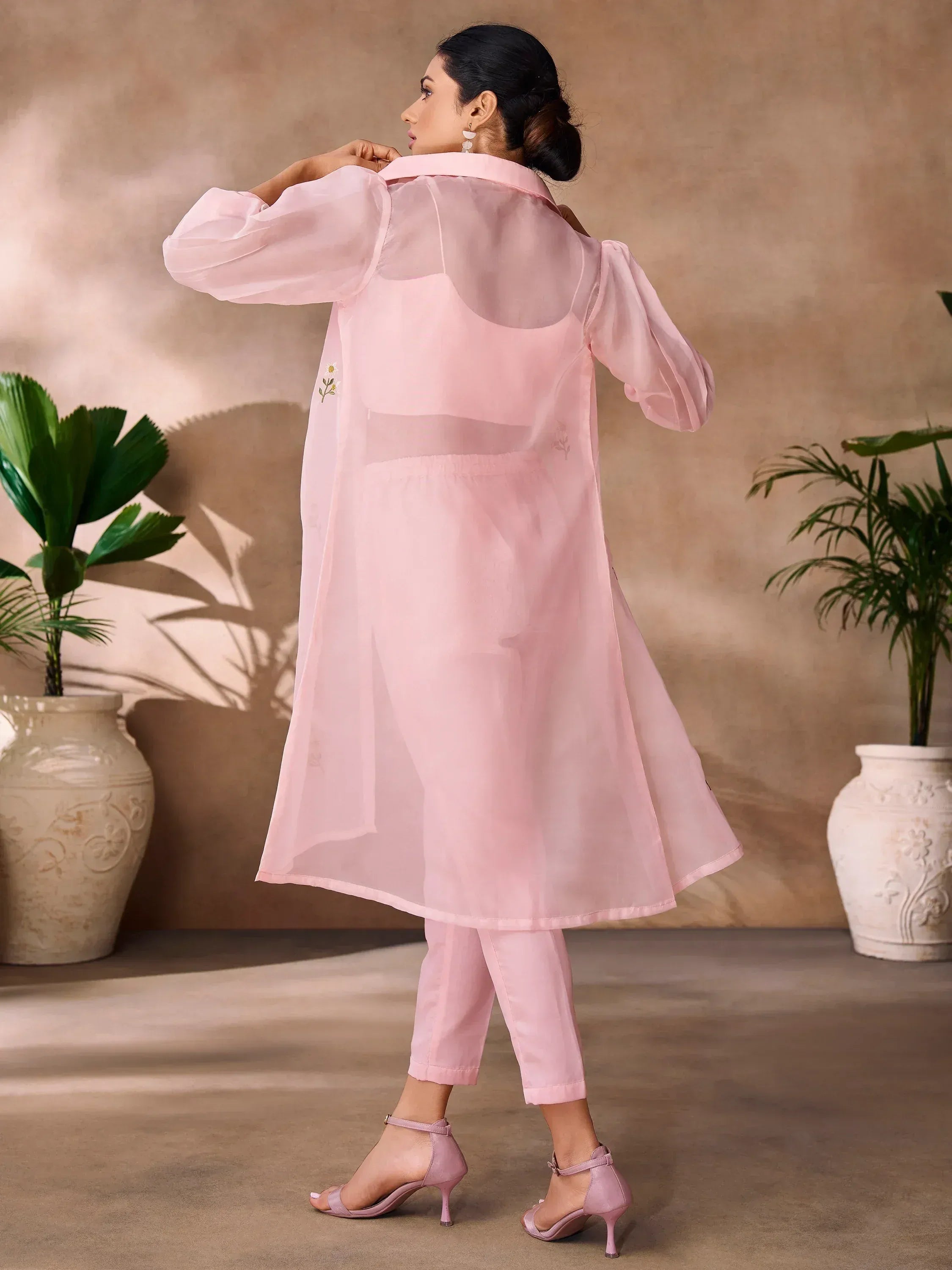 Pink sheer overlay kurta with floral embroidery, paired with matching pants and heels for ethnic wear
