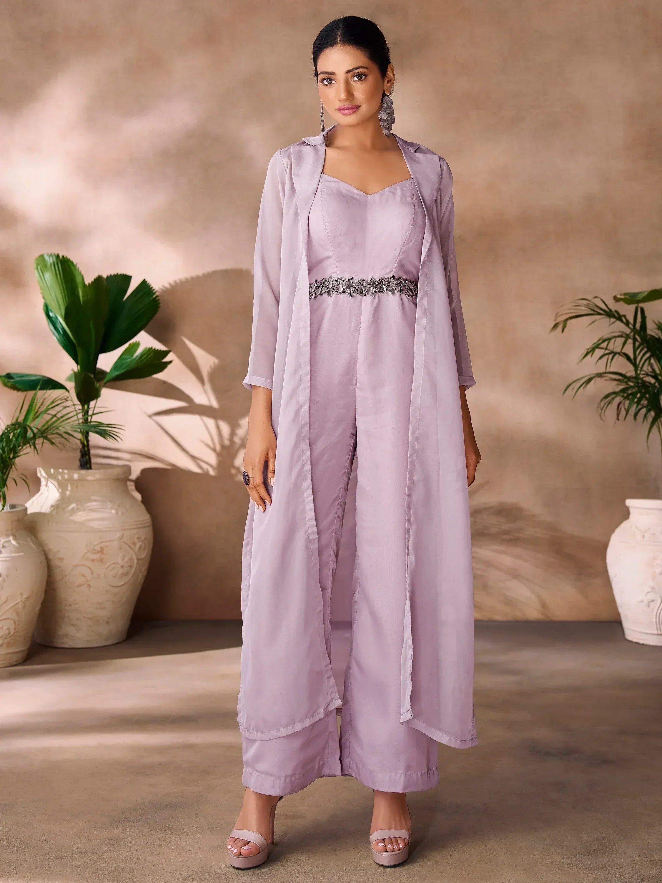 Lavender ethnic jumpsuit with embellished waist and matching duster, styled for modern Indian wear