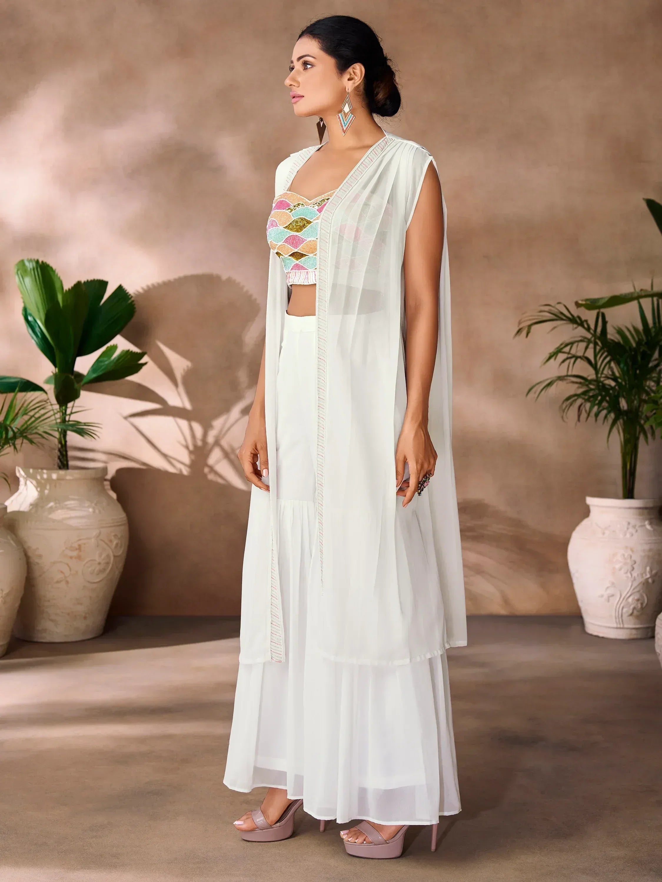 White ethnic gown with colorful embroidered blouse, perfect for Indian occasions and festive wear.