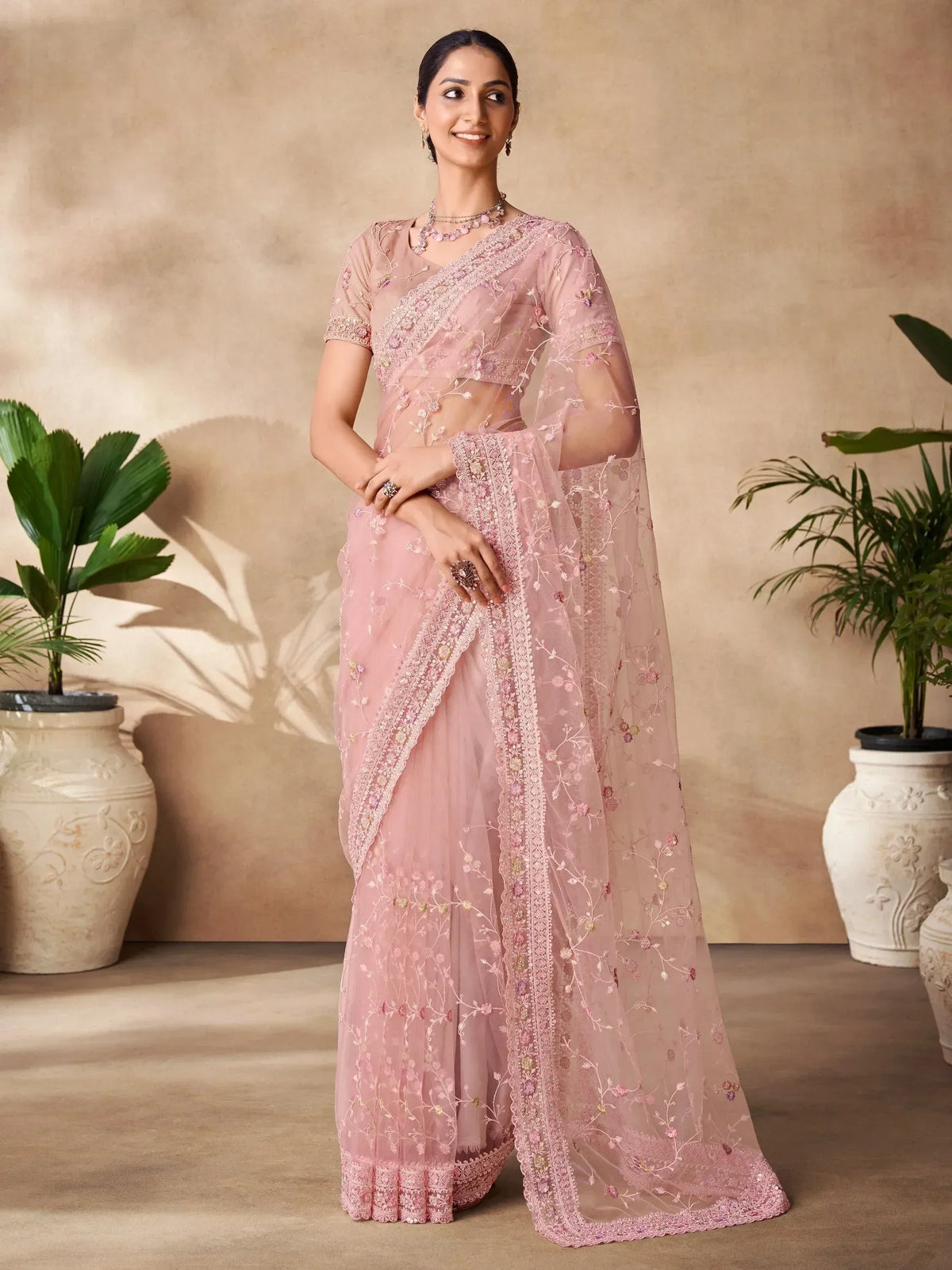 Pink embroidered saree with floral detailing, perfect for Indian ethnic wear and festive occasions