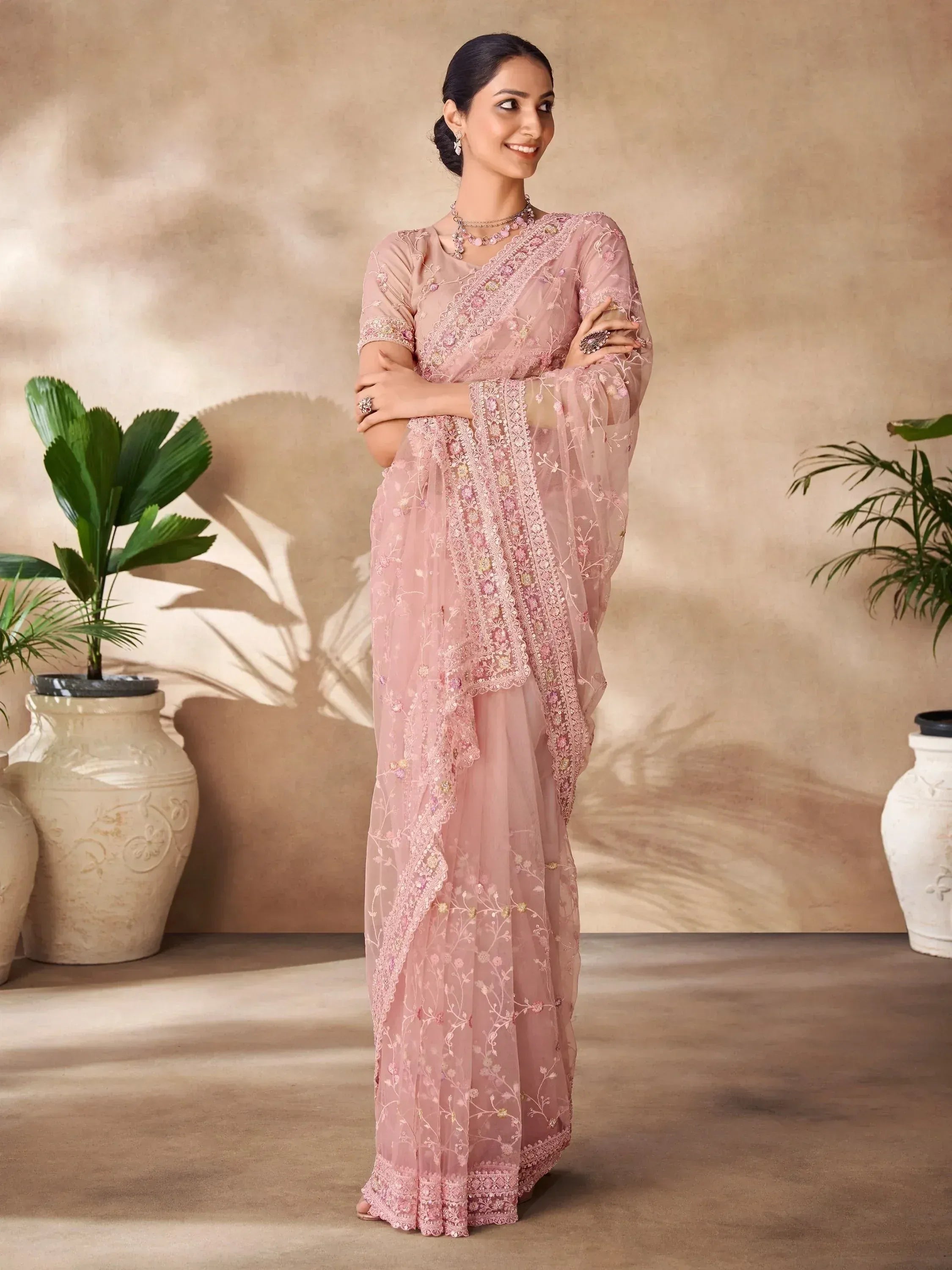 Pink embroidered saree with floral detailing, perfect for Indian ethnic wear occasions
