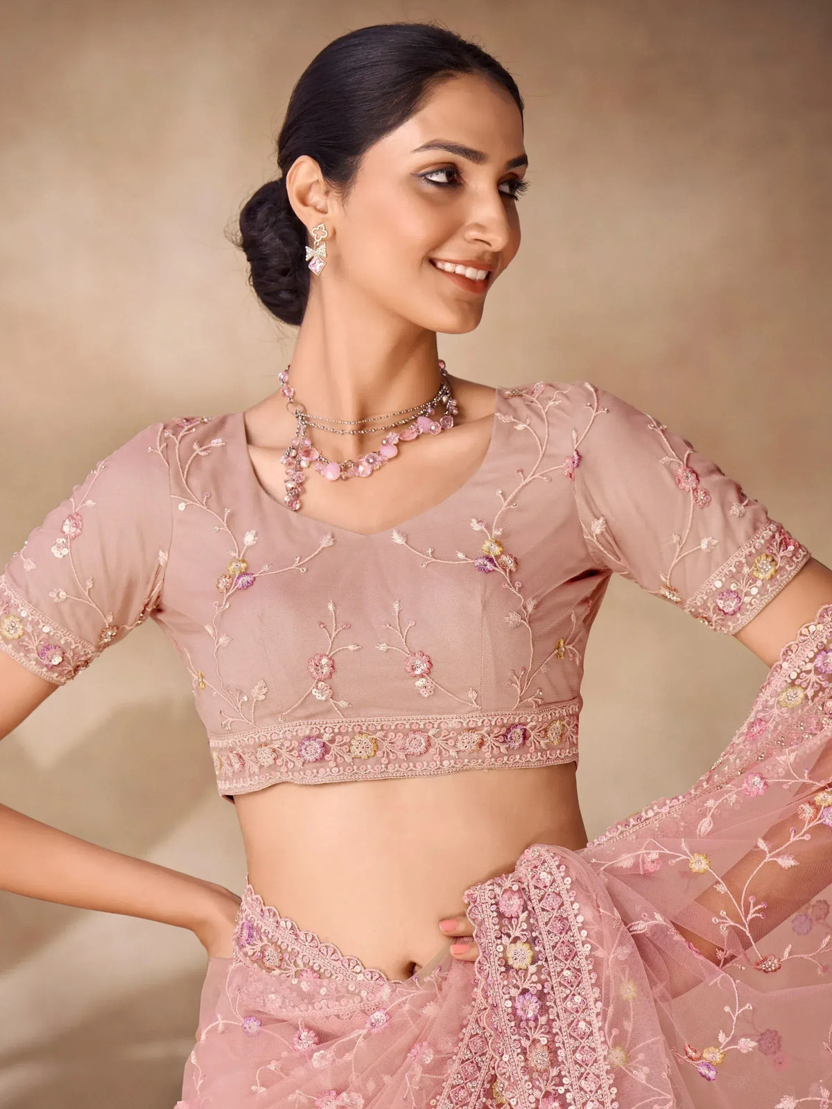 Pink embroidered lehenga choli with floral detailing, perfect for Indian ethnic wear occasions