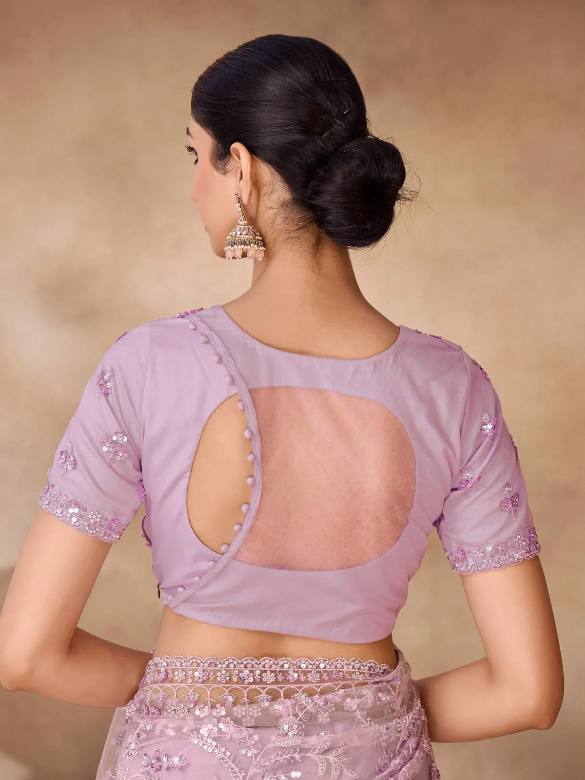 Lavender designer saree blouse with back cutout, floral embroidery, and sequin detailing for ethnic wear