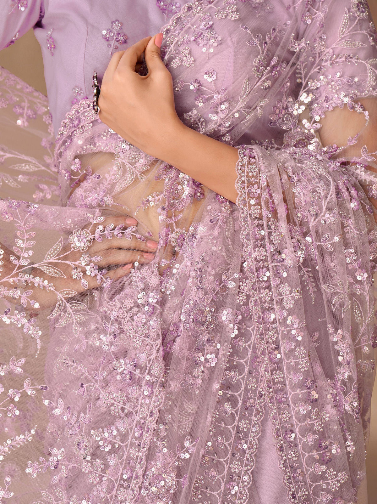 Lavender ethnic gown with floral sequin embroidery and sheer overlay, perfect for Indian festive wear.