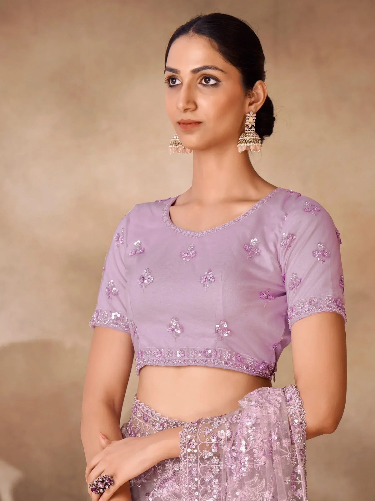 Lavender designer lehenga choli with floral sequin embroidery and matching jewelry for Indian ethnic wear