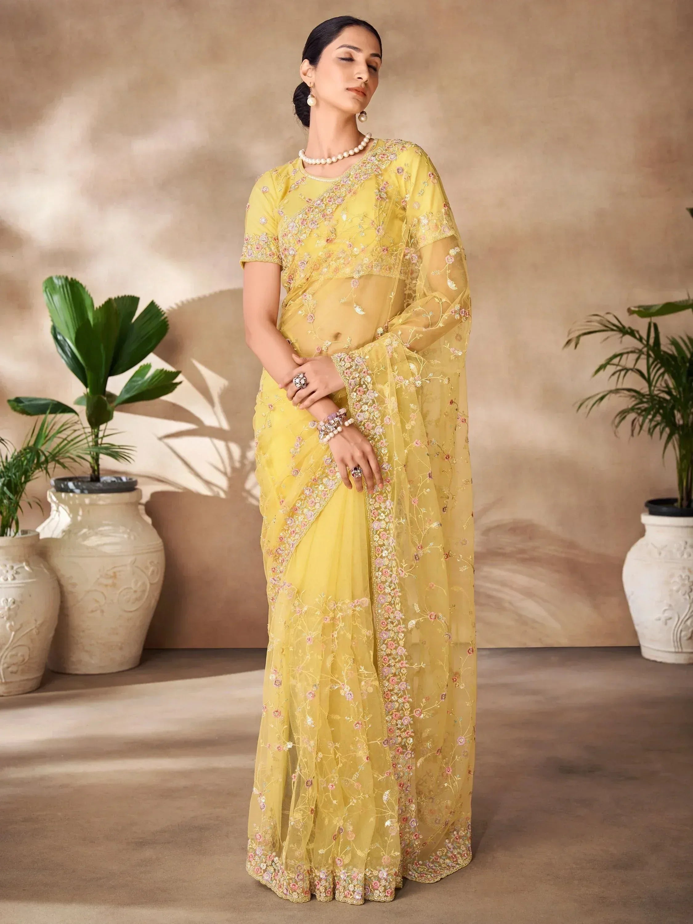 Yellow floral embroidered saree with matching blouse, perfect for Indian ethnic occasions