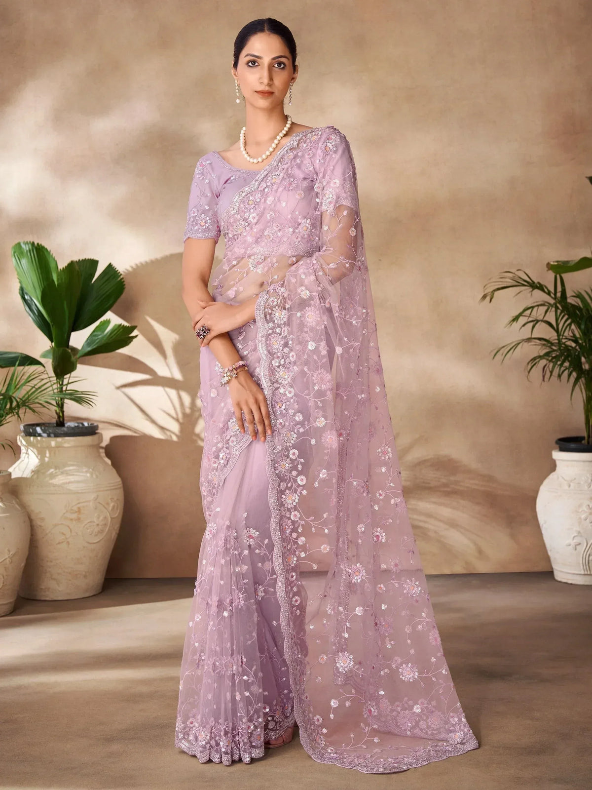 Lavender embroidered saree with floral motifs, perfect for Indian ethnic occasions and weddings.