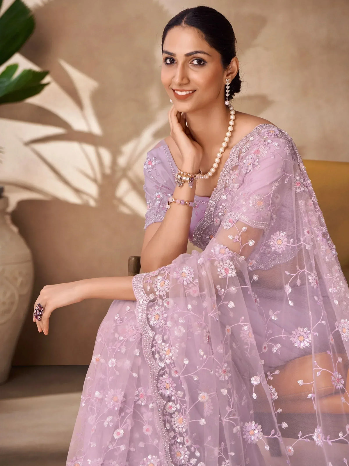 Lavender embroidered ethnic gown with floral sequin detailing, perfect for Indian weddings and parties