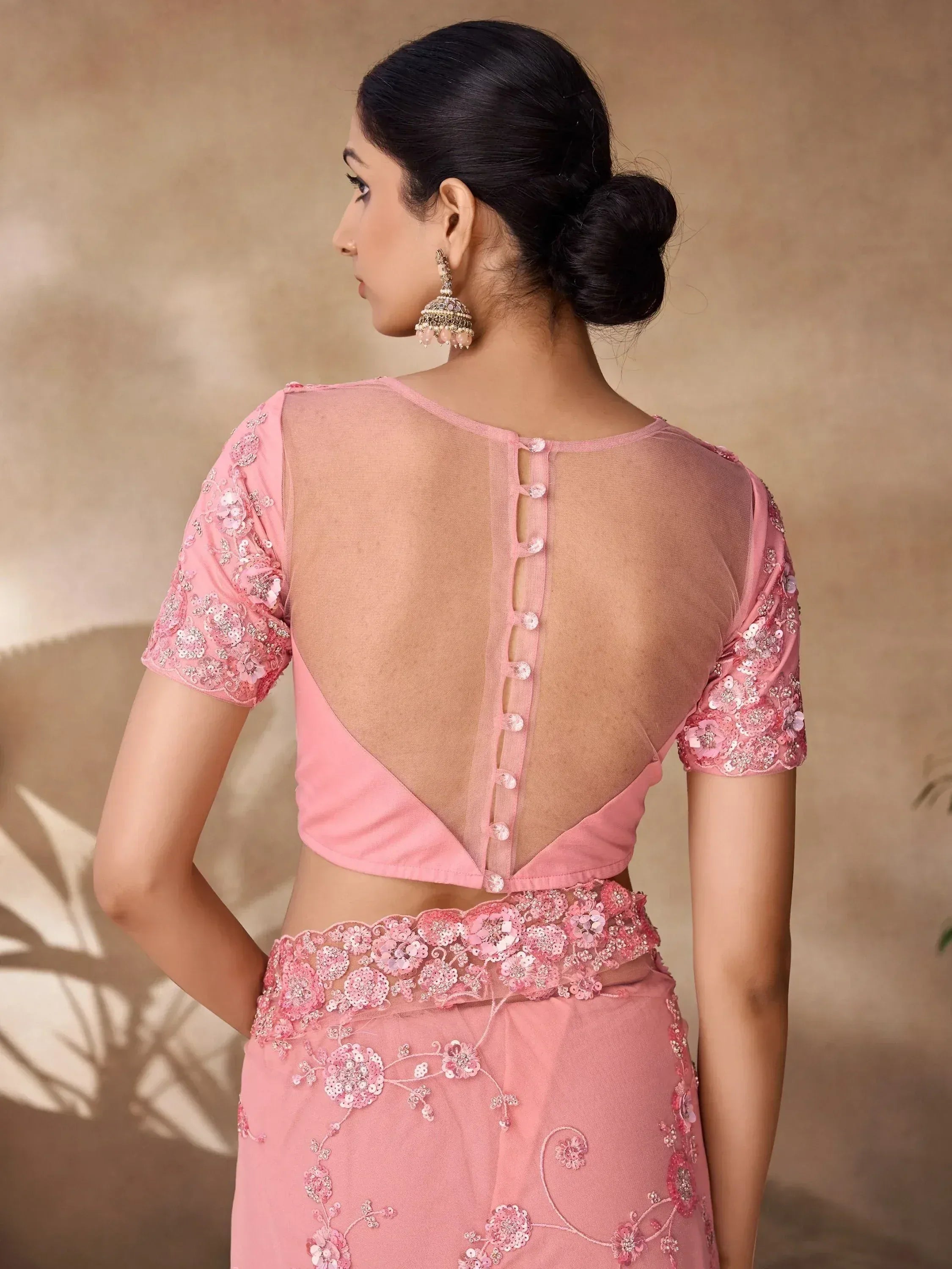 Pink embroidered lehenga choli with sheer back and floral sequin detailing, perfect for Indian ethnic wear