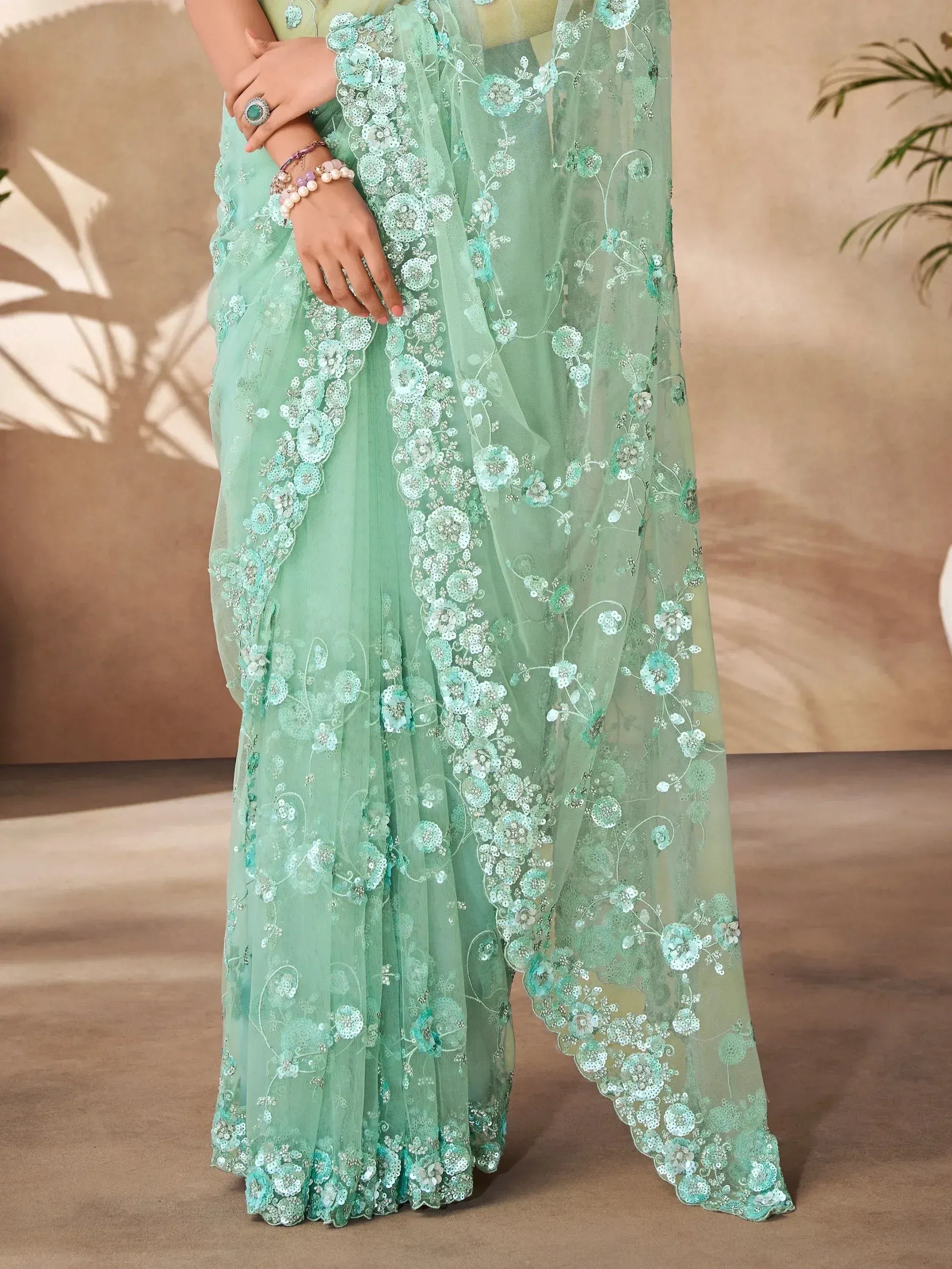 Mint green embroidered saree with floral sequin work, perfect for Indian ethnic occasions