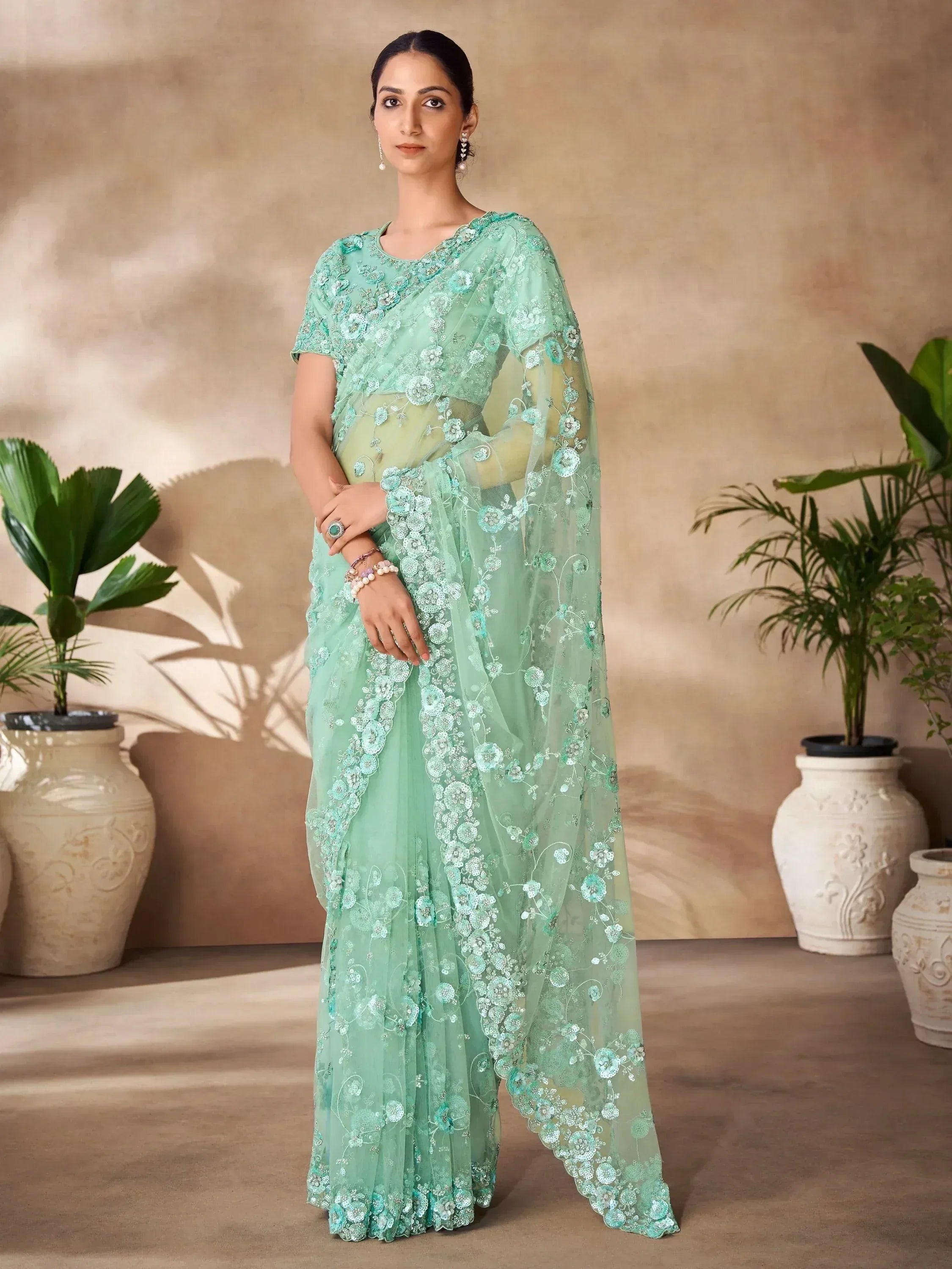 Mint green embroidered saree with floral lace, perfect for Indian ethnic wear events