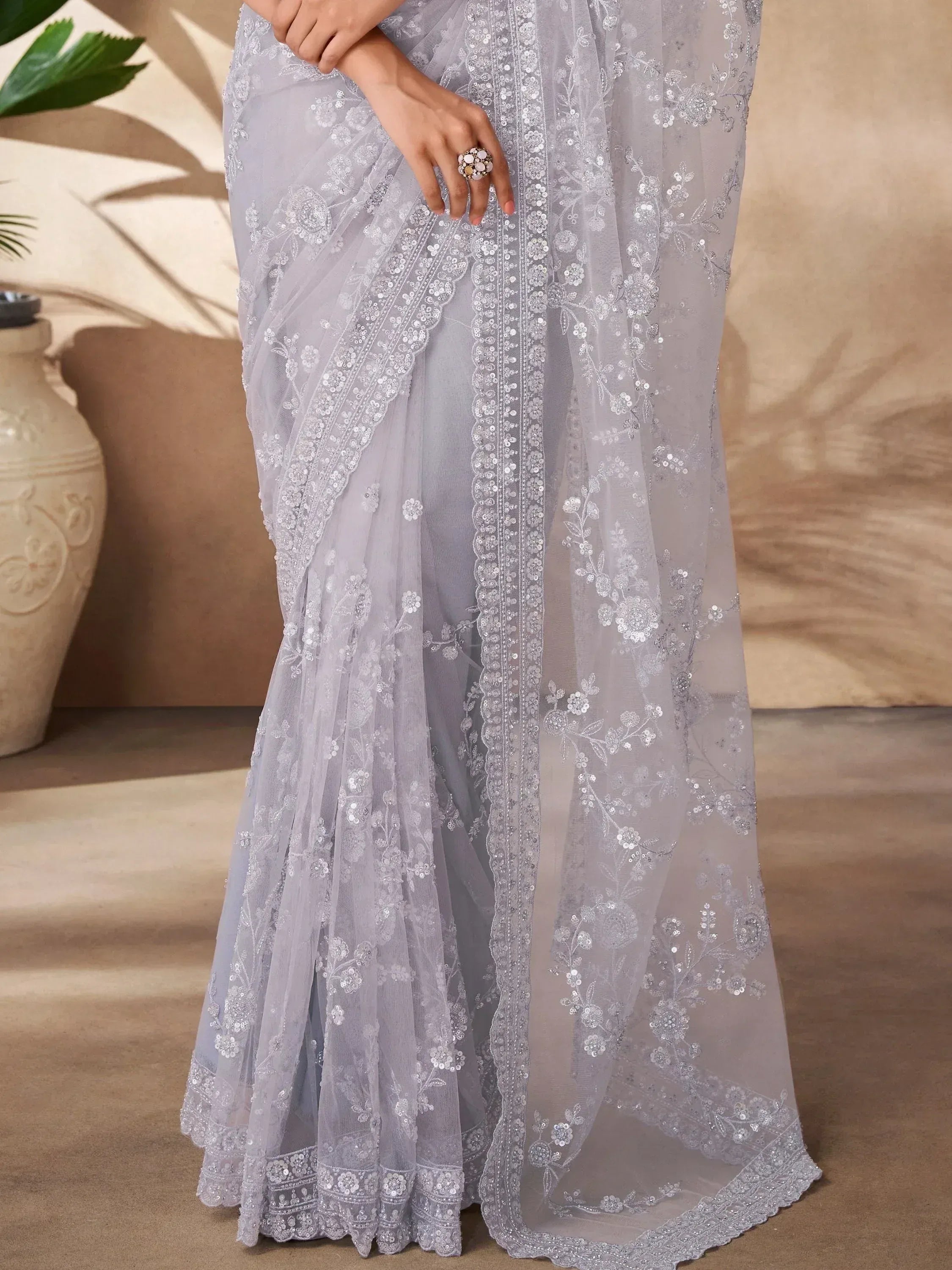 Elegant grey saree with floral sequin embroidery, perfect for Indian ethnic wear occasions.