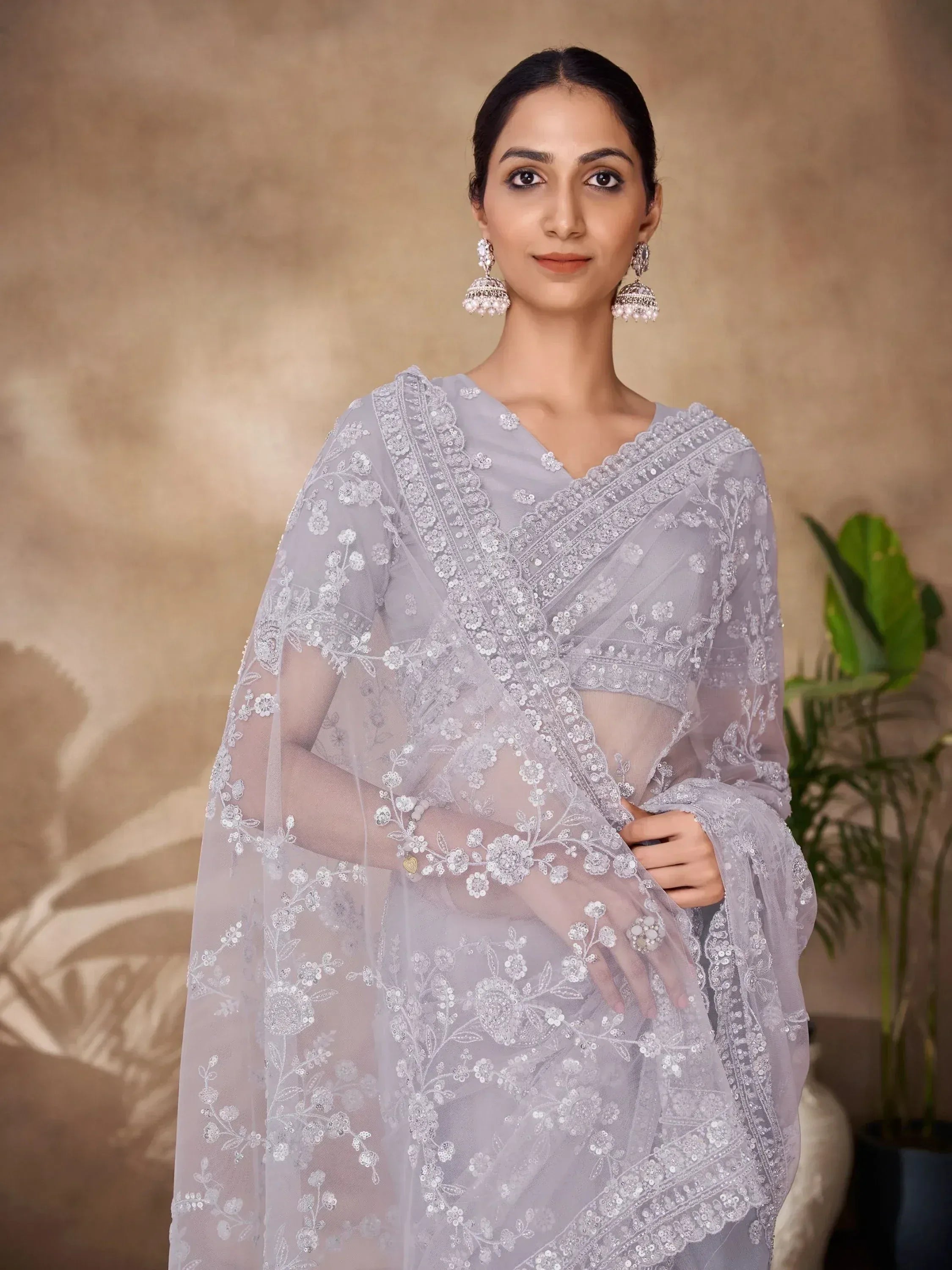Elegant grey embroidered saree with floral lace detailing, perfect for Indian ethnic wear occasions