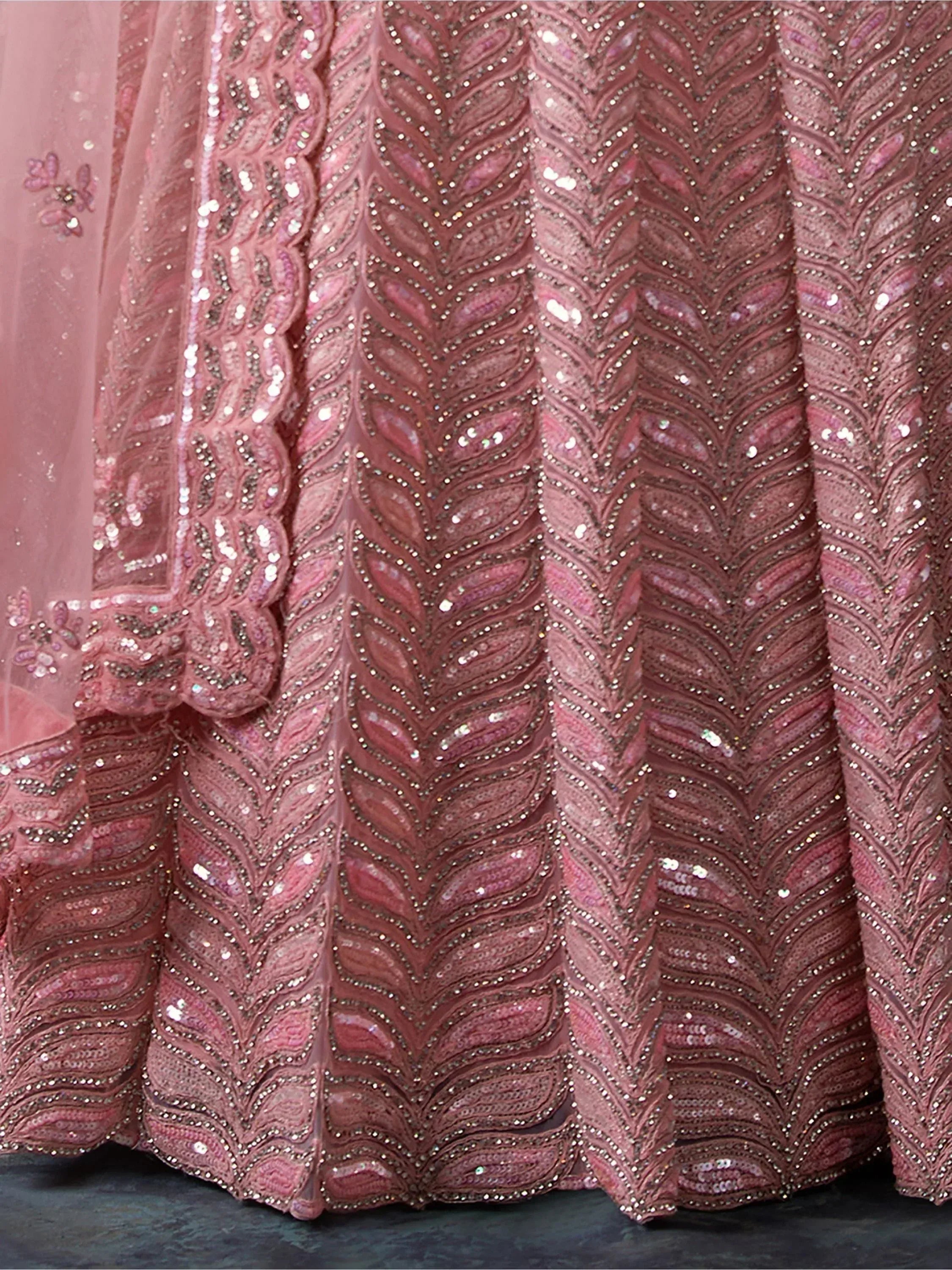 Pink designer lehenga with intricate sequin and beadwork, perfect for Indian ethnic wear events.