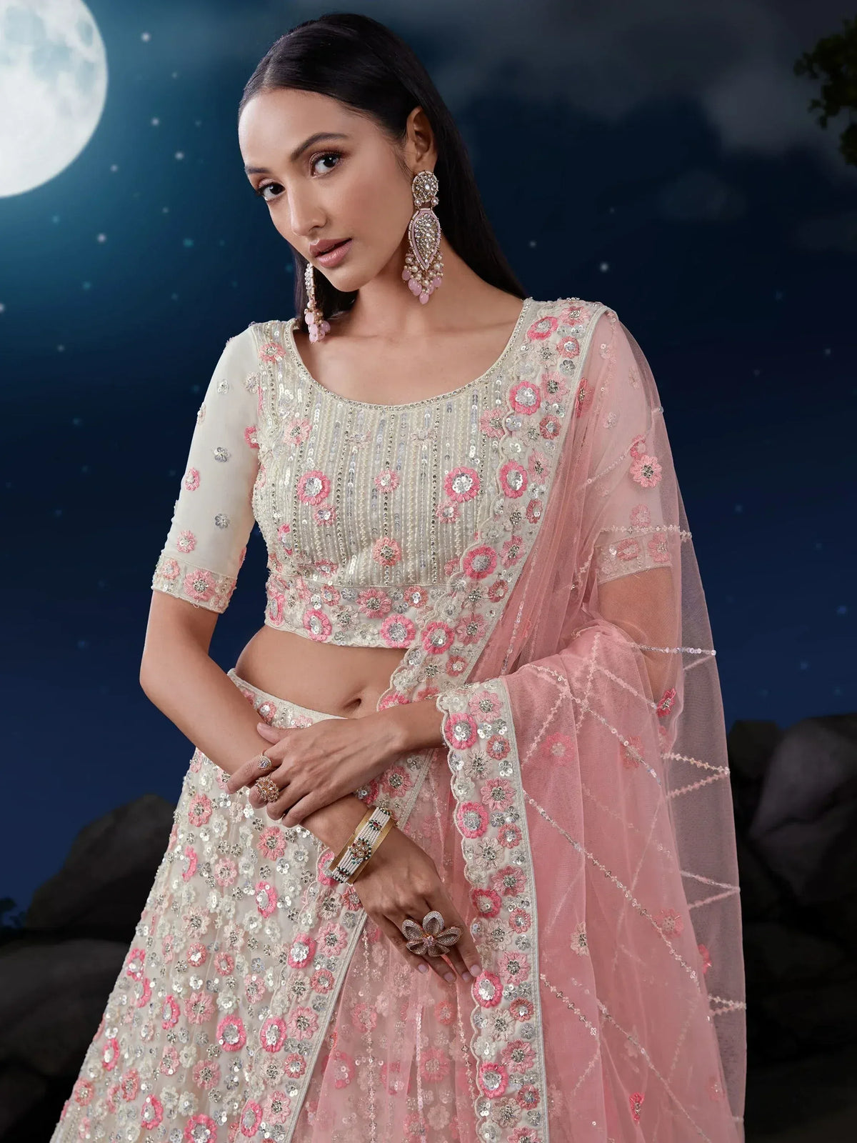 Elegant ivory and pink floral embroidered lehenga choli with sheer dupatta, perfect for Indian ethnic occasions