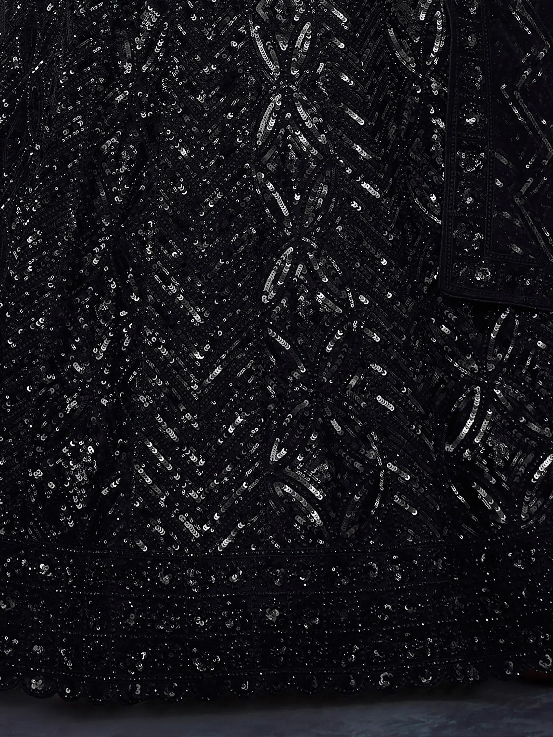 Black sequin ethnic gown with geometric pattern, perfect for Indian festive occasions and parties.