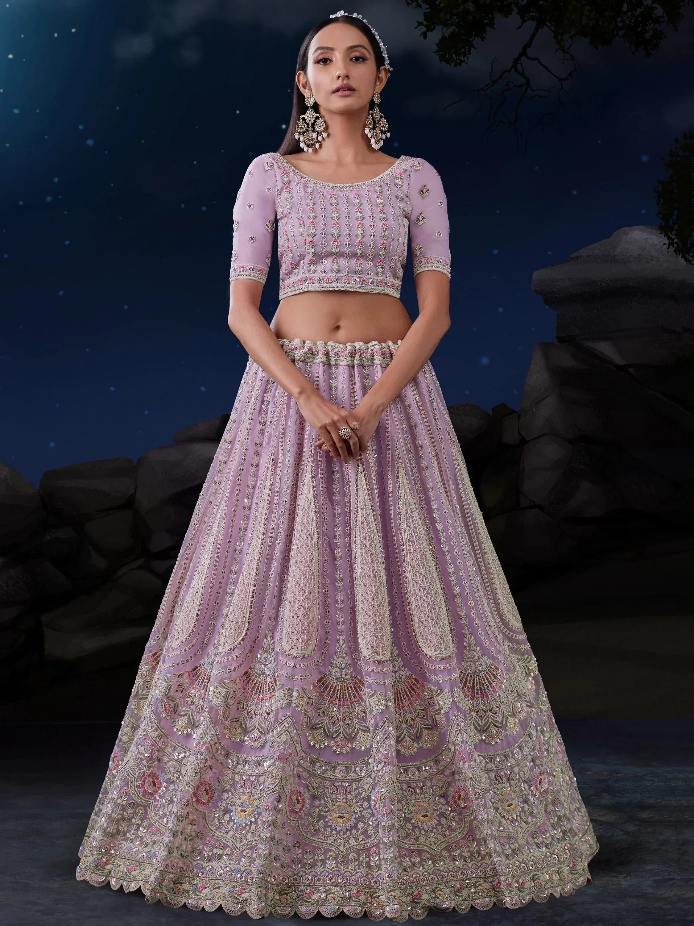Lavender designer lehenga choli with intricate embroidery, perfect for Indian weddings and festive occasions.
