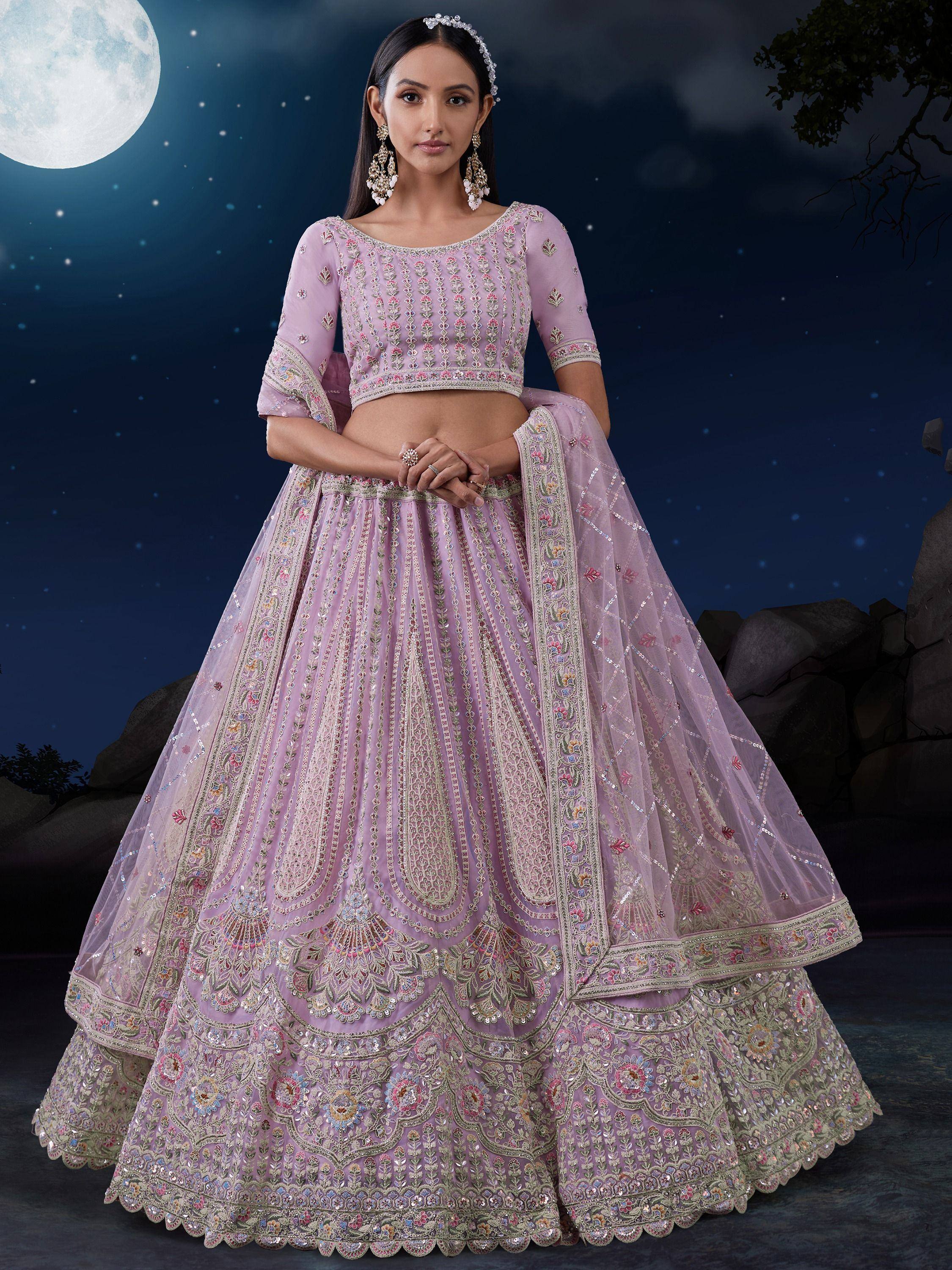 Lavender embroidered lehenga choli with floral motifs, perfect for Indian weddings and festive occasions under moonlight.