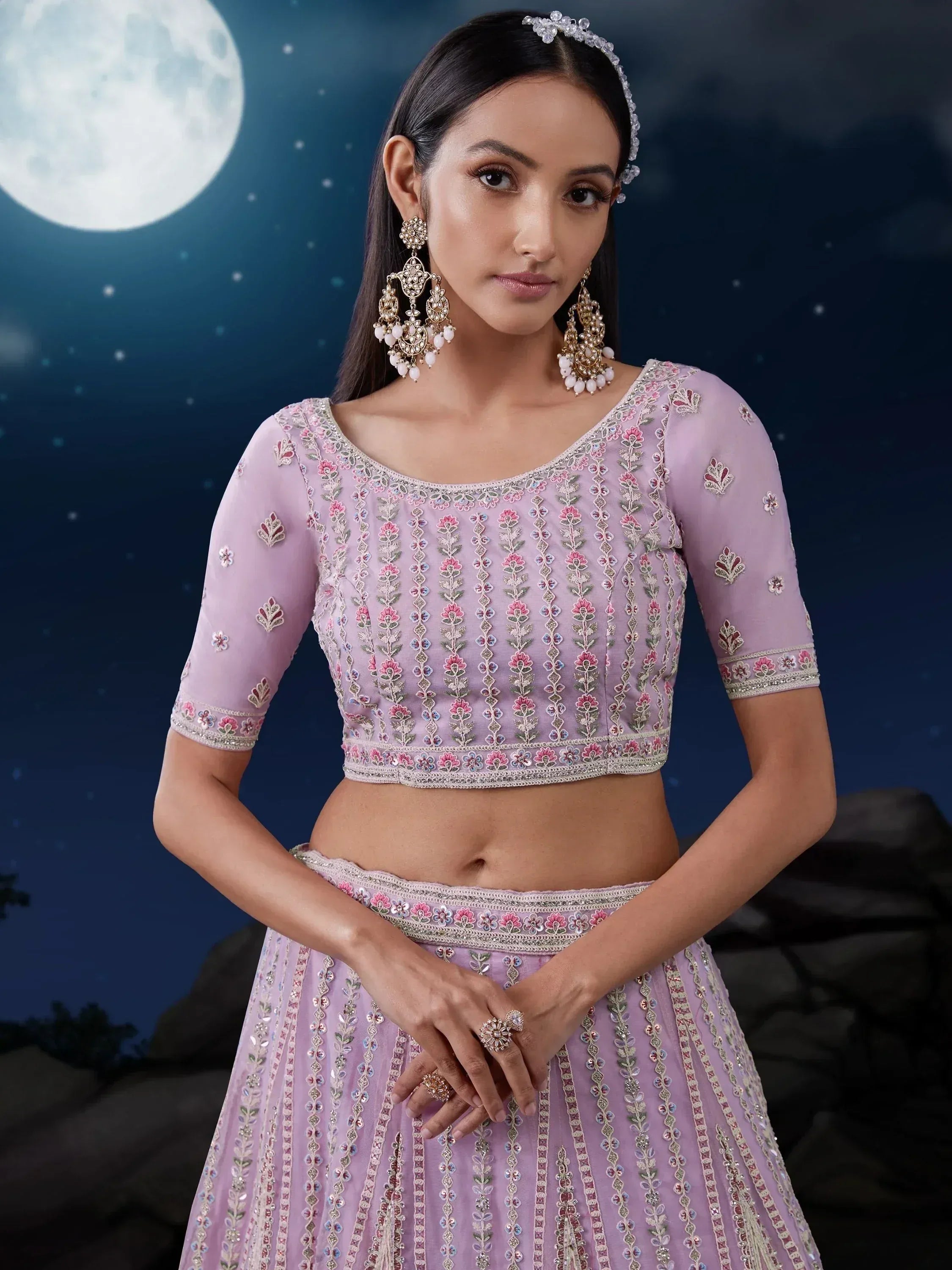 Lavender embroidered lehenga choli with floral motifs, perfect for Indian ethnic wear and festive occasions.