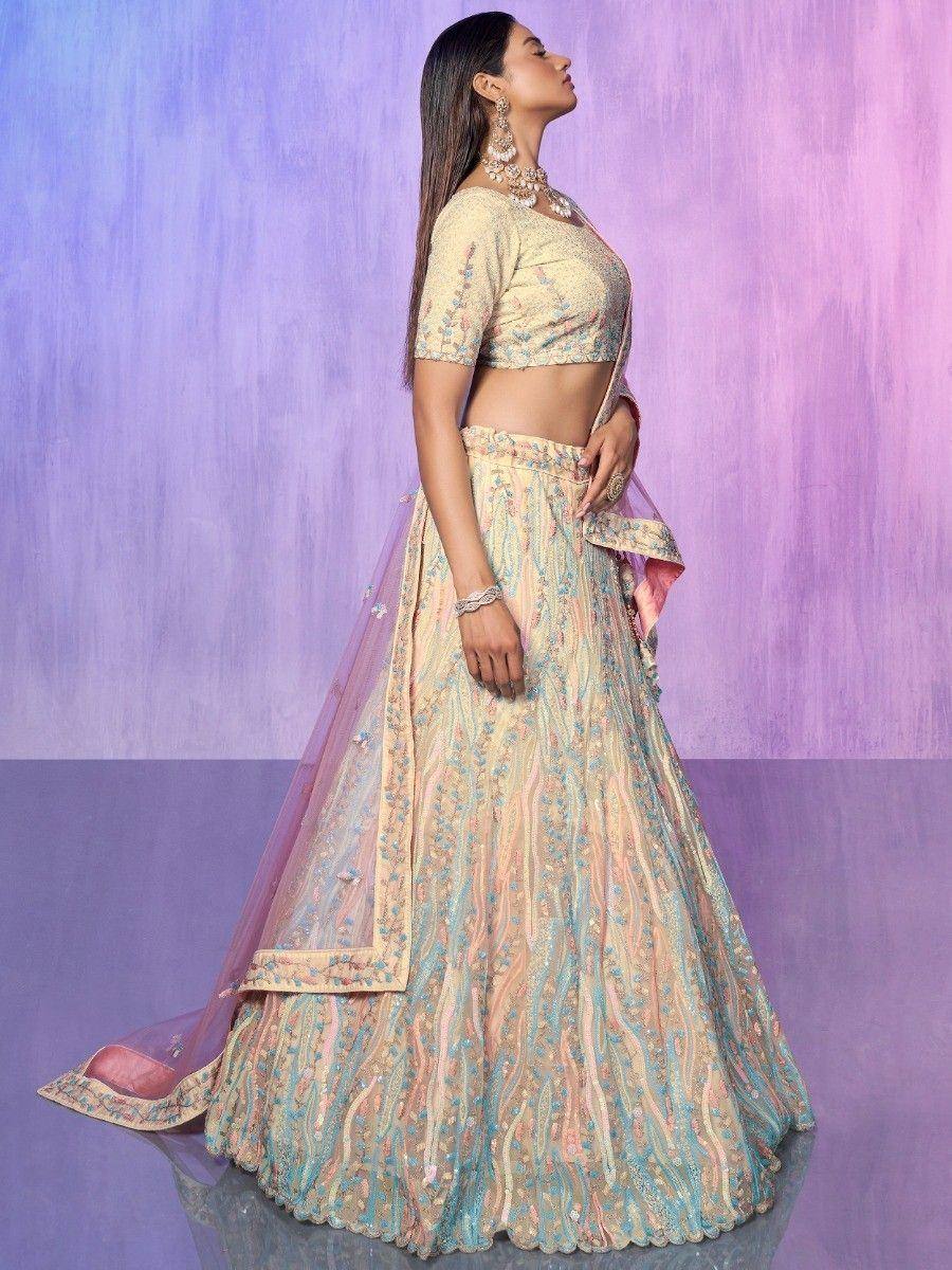 Elegant pastel lehenga choli with floral embroidery, perfect for Indian weddings and festive occasions.