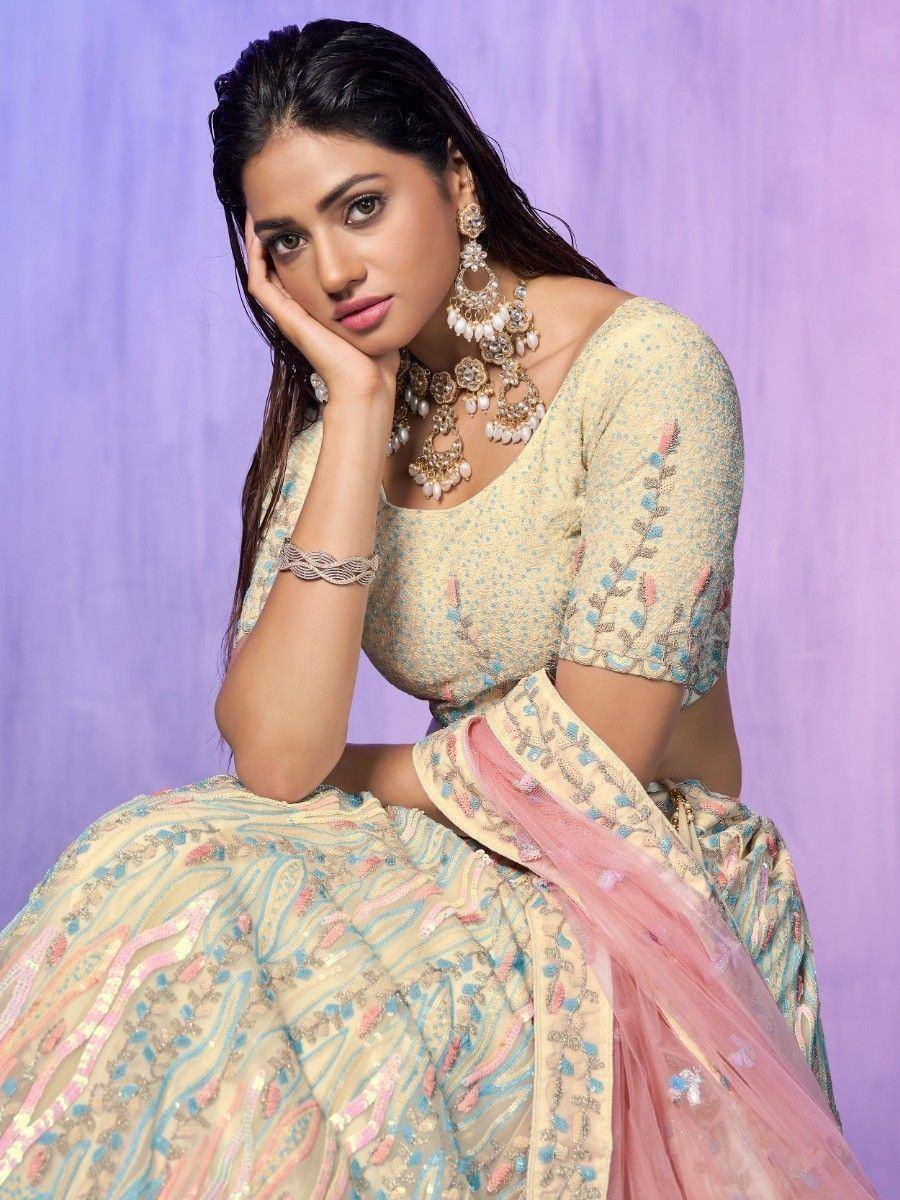Elegant designer lehenga choli with pastel embroidery, perfect for Indian ethnic wear occasions