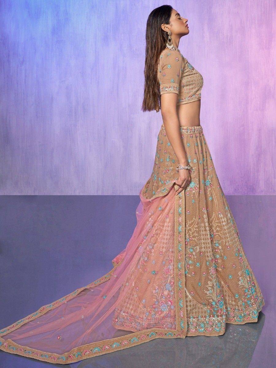Elegant beige lehenga choli with floral embroidery and pink dupatta, perfect for Indian ethnic occasions.