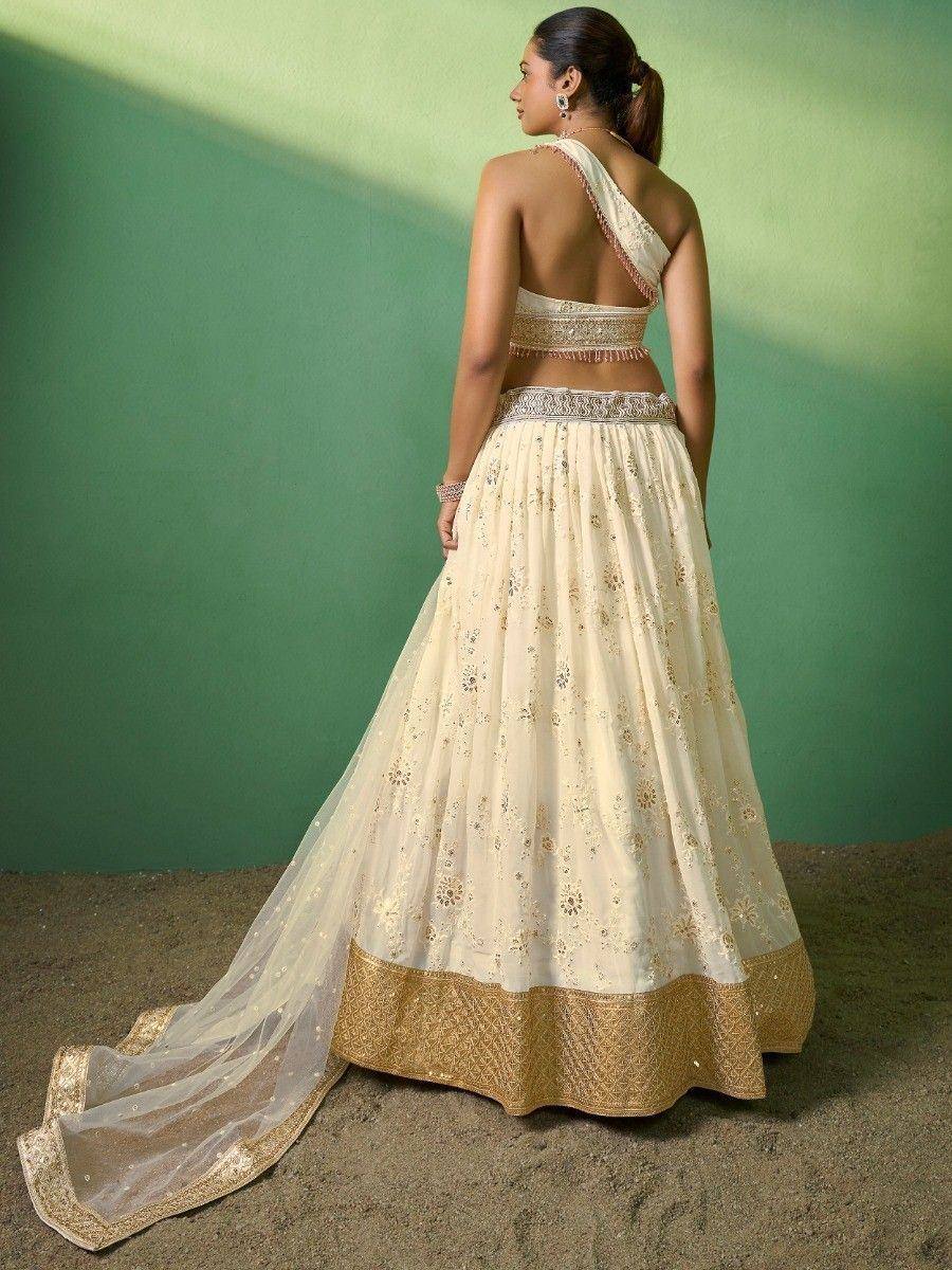 Cream and gold embroidered lehenga choli with open back and dupatta, Indian ethnic wear