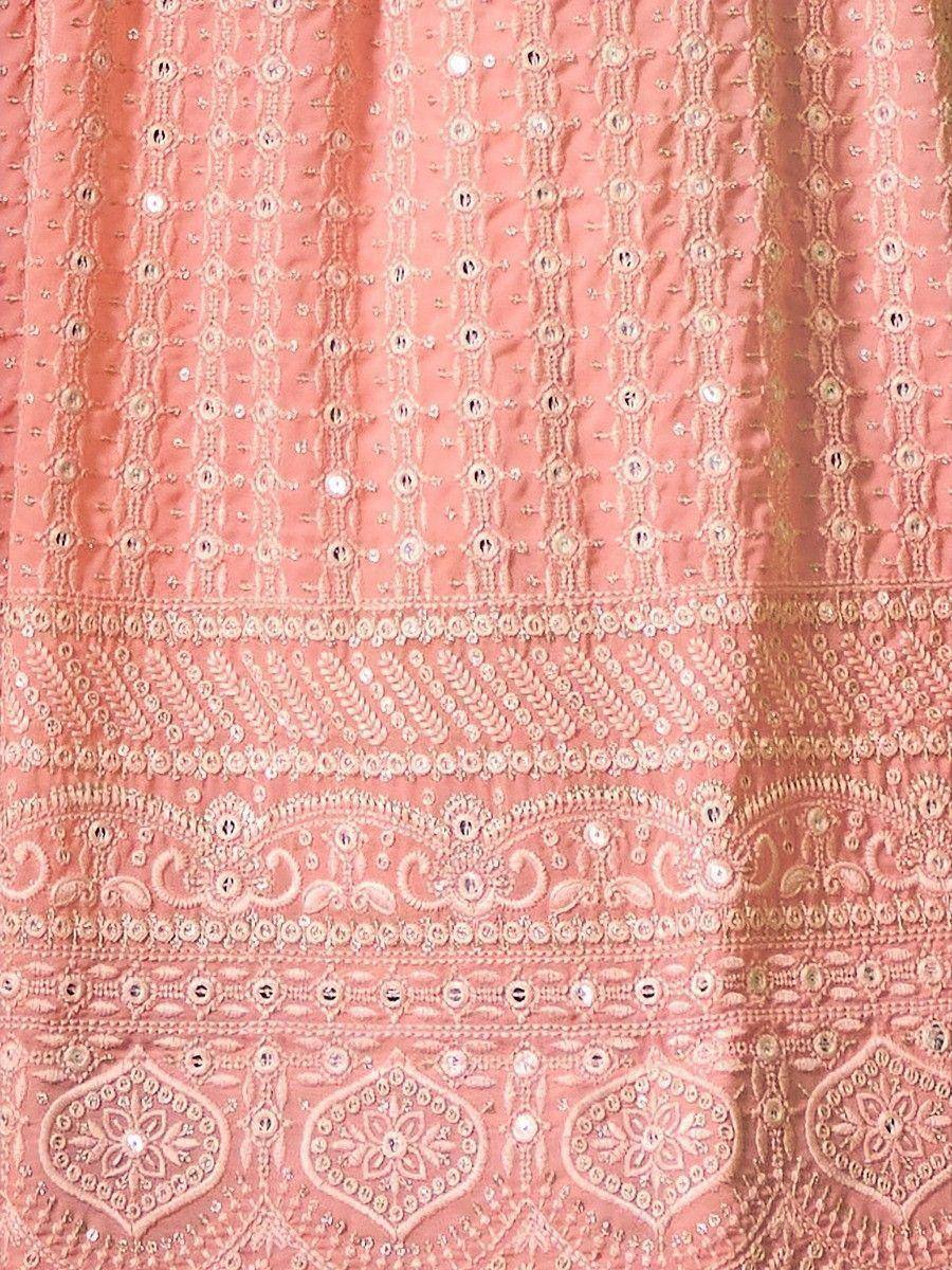 Pink ethnic lehenga with intricate embroidery and mirror work detailing
