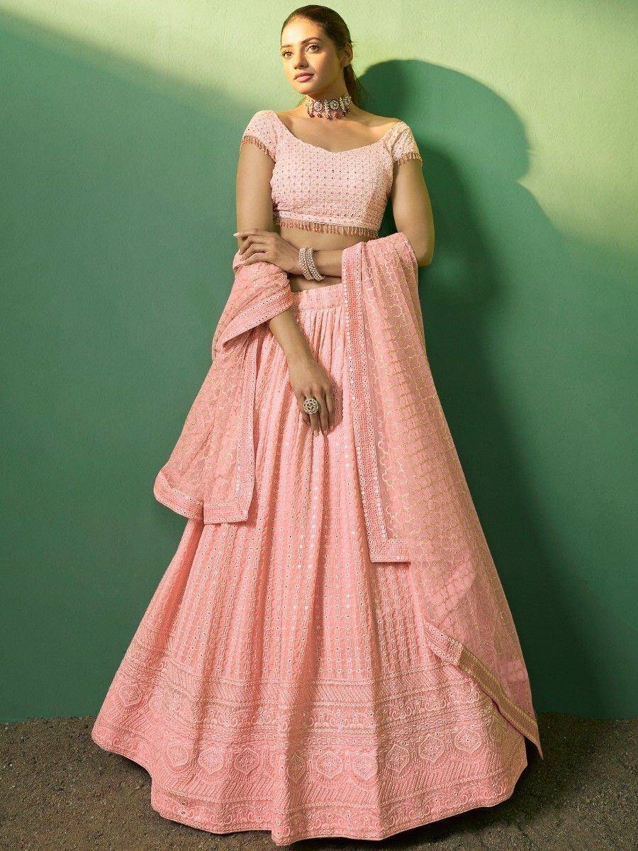 Pink embroidered lehenga choli with off-shoulder blouse, perfect for Indian weddings and festive occasions