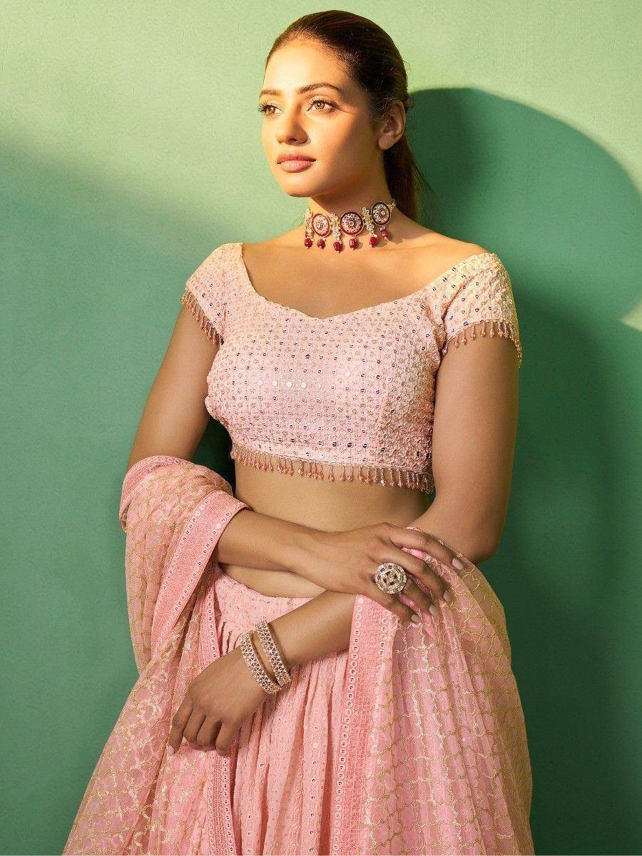Pink sequined lehenga choli with gold embroidery, perfect for Indian ethnic wear and festive occasions
