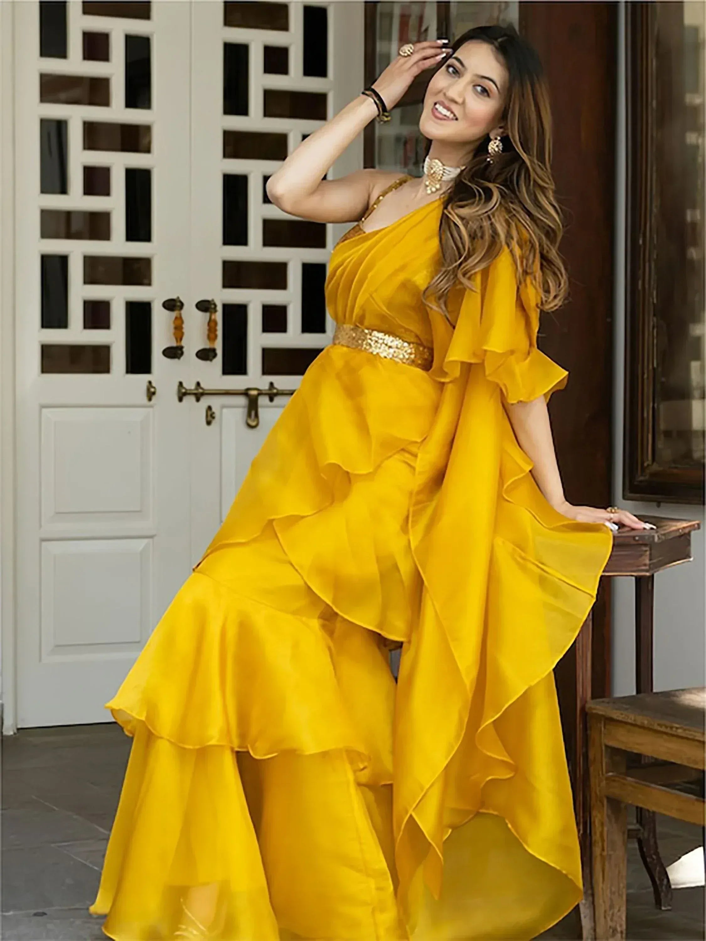 Yellow ethnic gown with ruffles and gold belt, perfect for Indian festive occasions