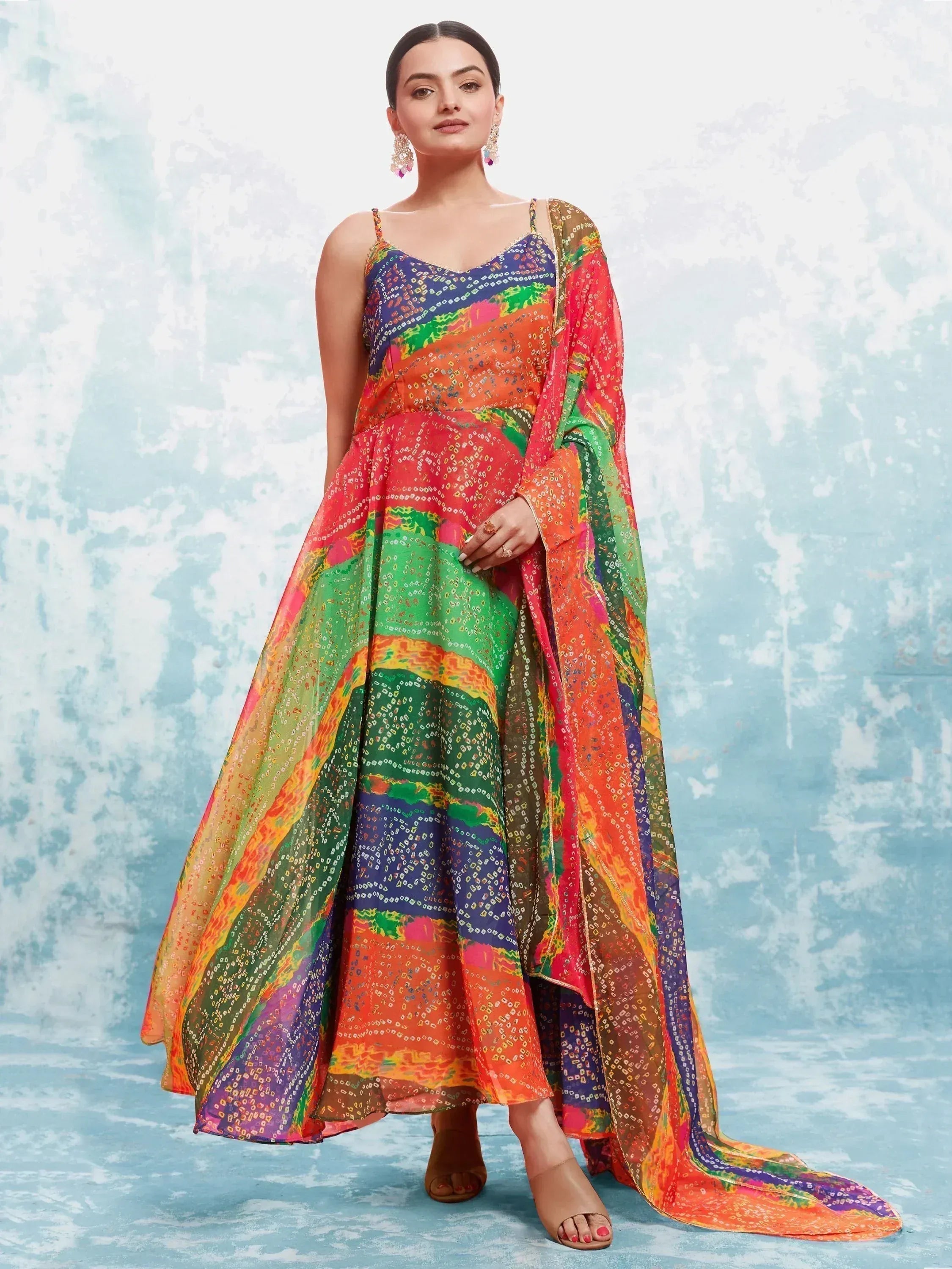 Woman in colorful traditional Indian ethnic gown with dupatta, festive printed design