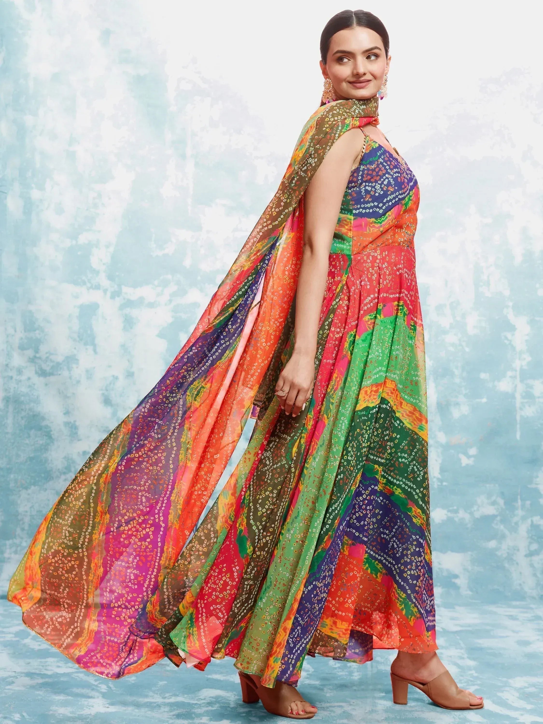 Woman wearing colorful bandhani print ethnic gown with dupatta, salwar kameez style