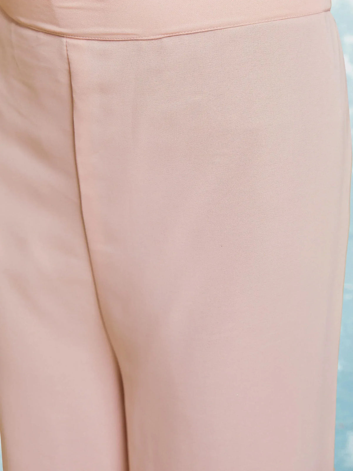 Soft pink palazzo pants with high waist and pleated front, ideal for ethnic wear outfits