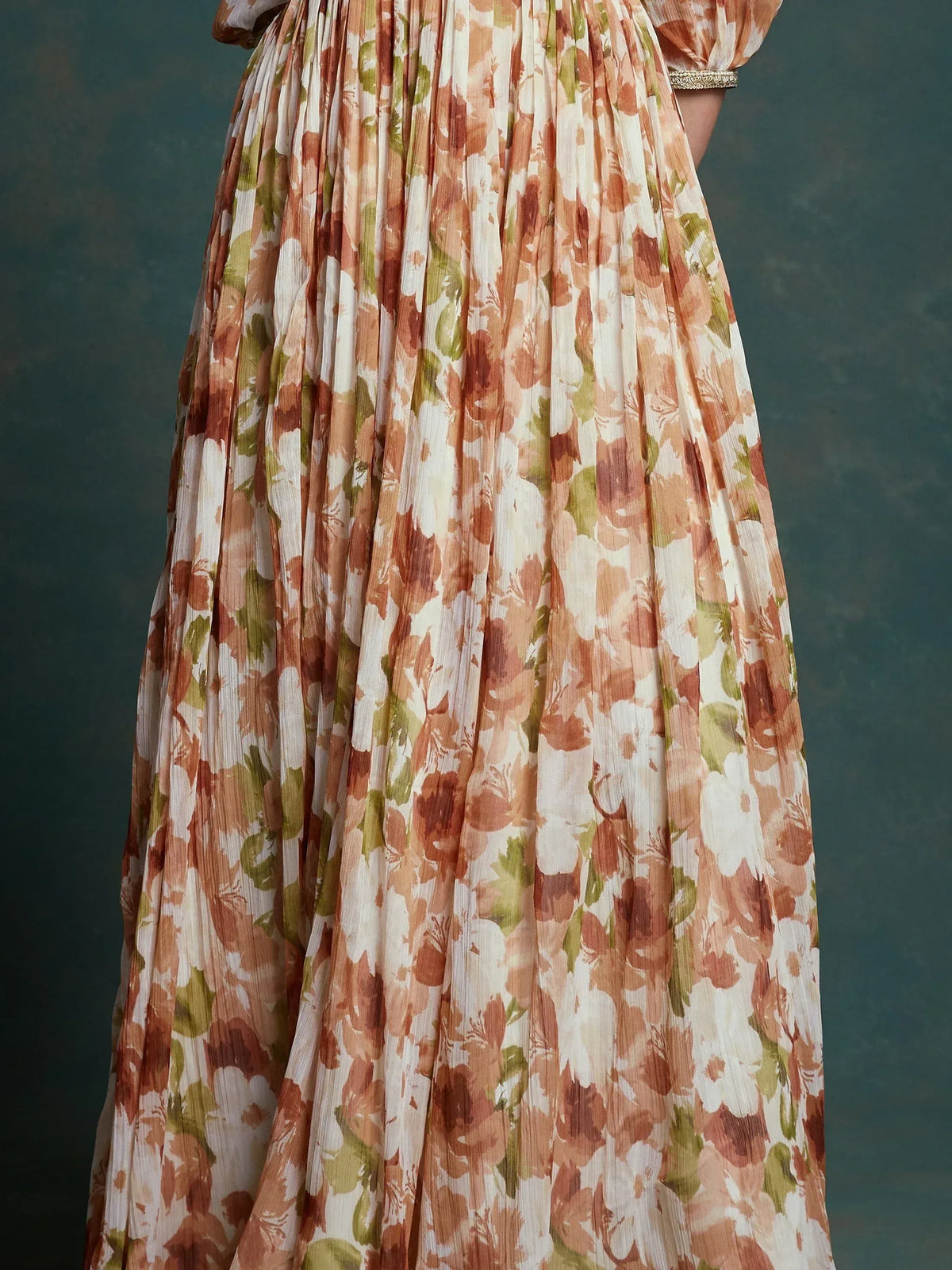 Floral print ethnic gown with pleated skirt and puff sleeves, perfect for Indian occasions