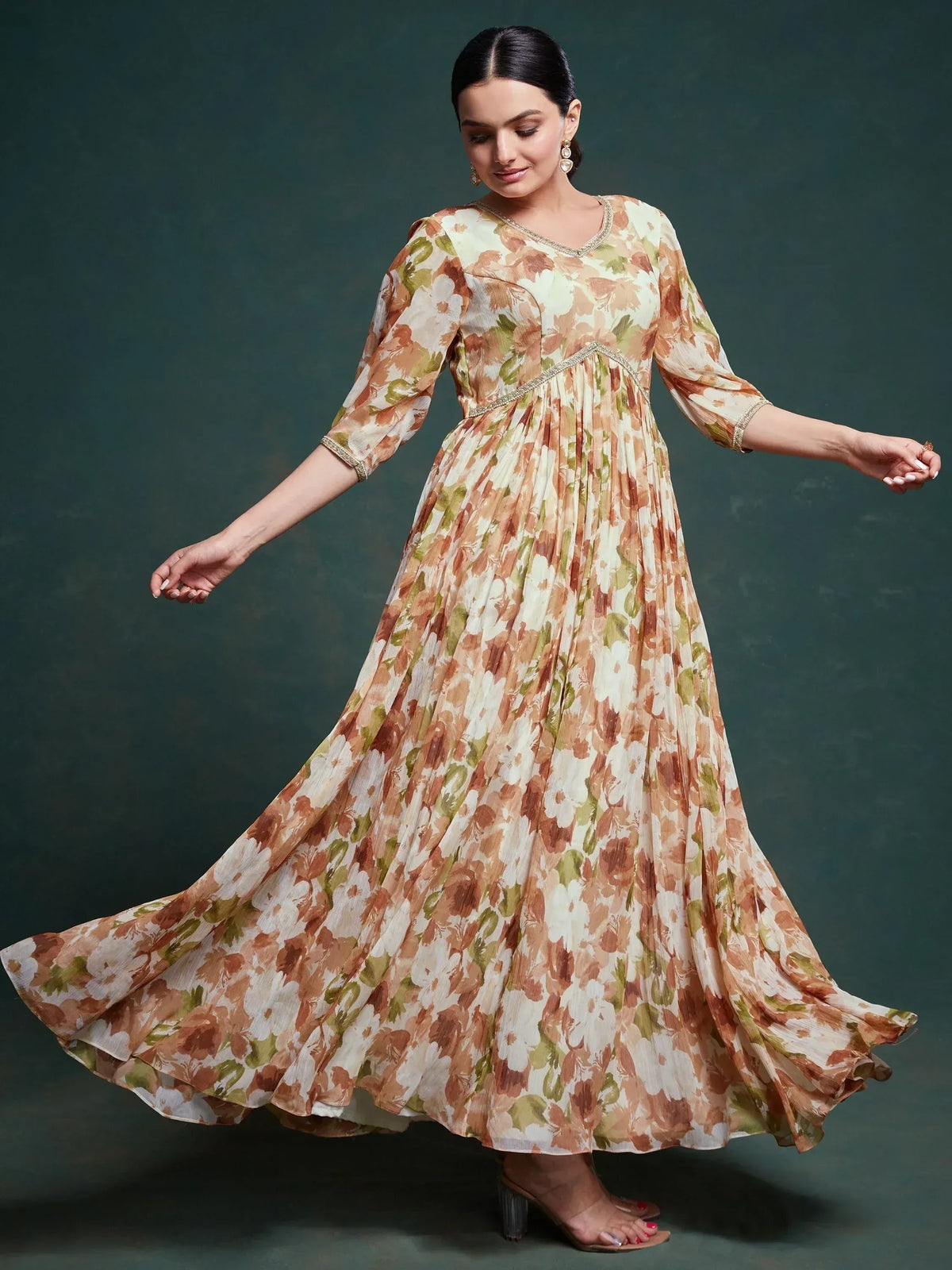 Floral print ethnic gown with pleated skirt and gold trim, perfect for Indian occasions