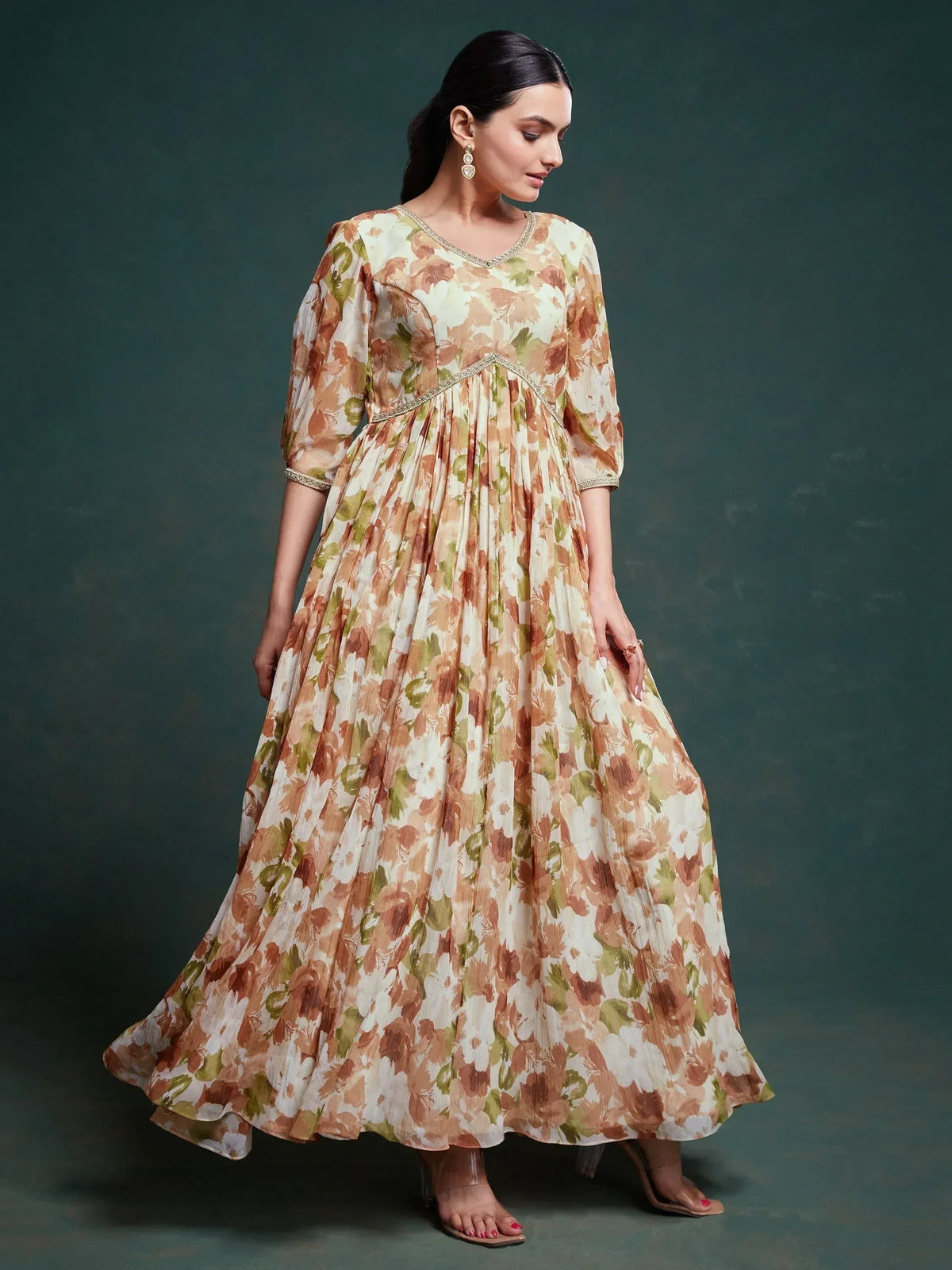 Floral print ethnic gown with pleated skirt and gold trim, perfect for Indian occasions